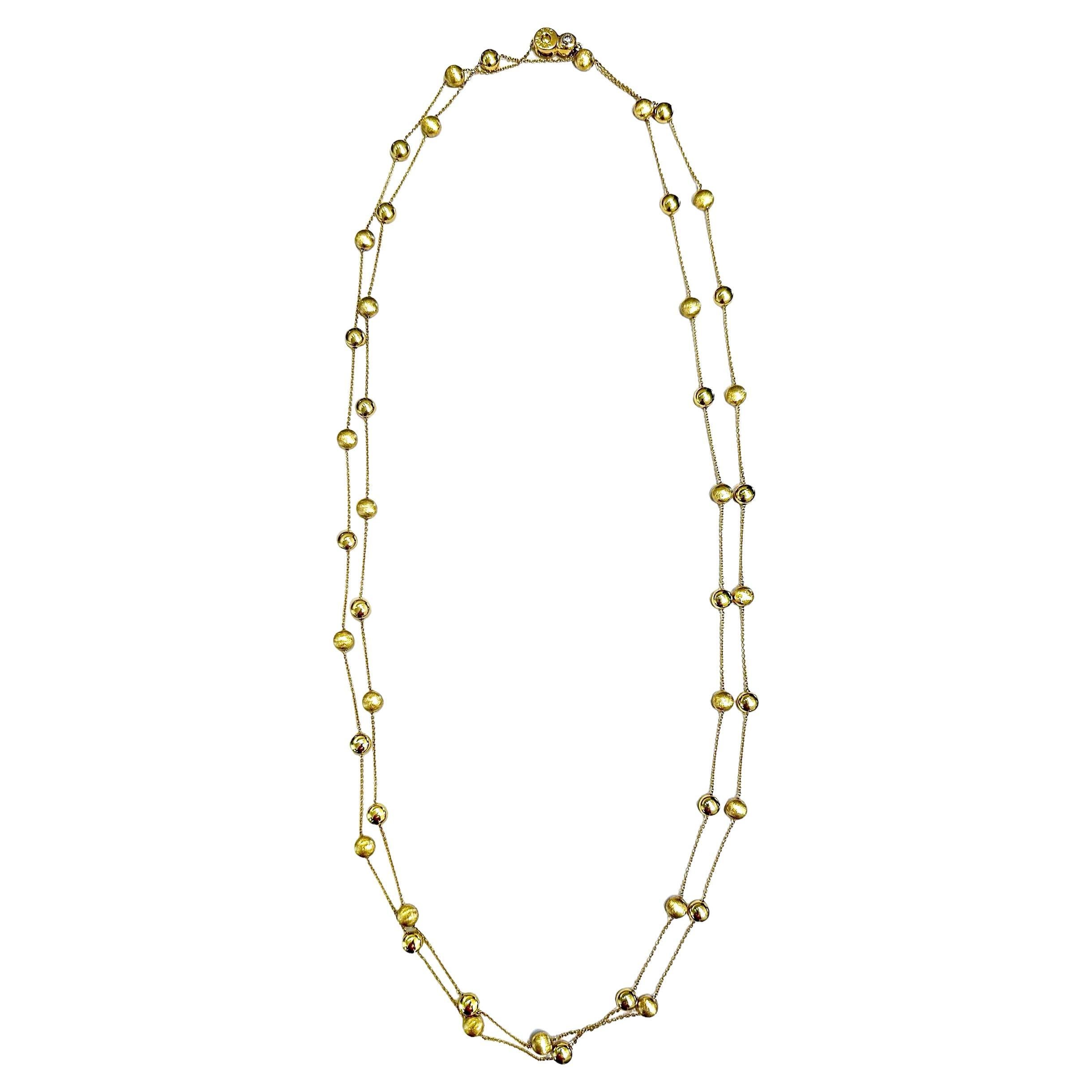 This stylish 18k yellow gold creation by respected Italian Manufacturer Chimento, is an amazing 54 inches in length. The .70mm cable link chain is punctuated every 1 1/8 inches by alternating 6mm high polish and double Florentine finish gold beads.