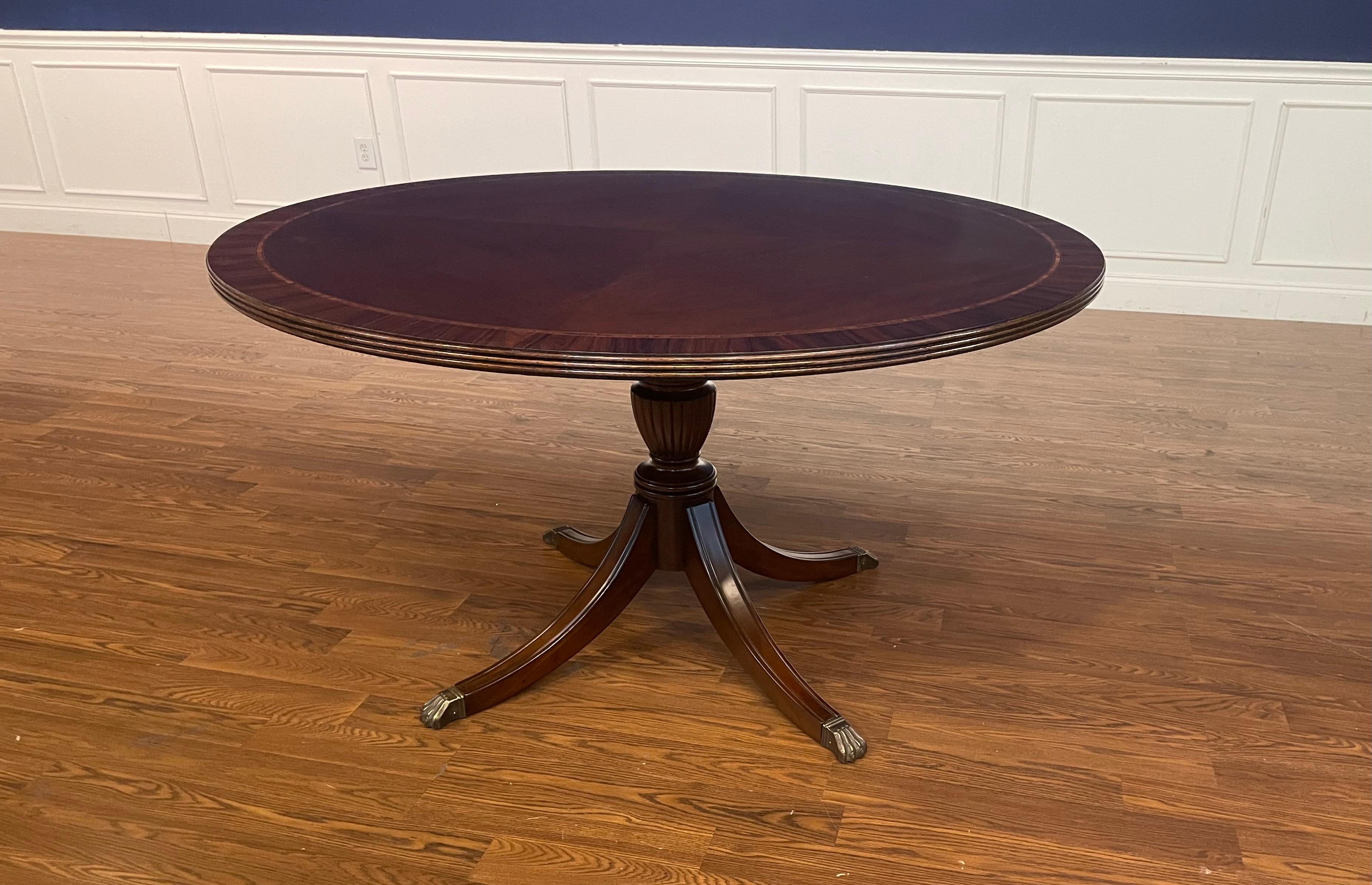 This is a beautiful 54 inch diameter traditional mahogany dining table bench made in the Leighton Hall shop in Suwanee, Georgia.  It is a showroom sample and is less than one year old.  It is in very good condition with only very minor imperfections