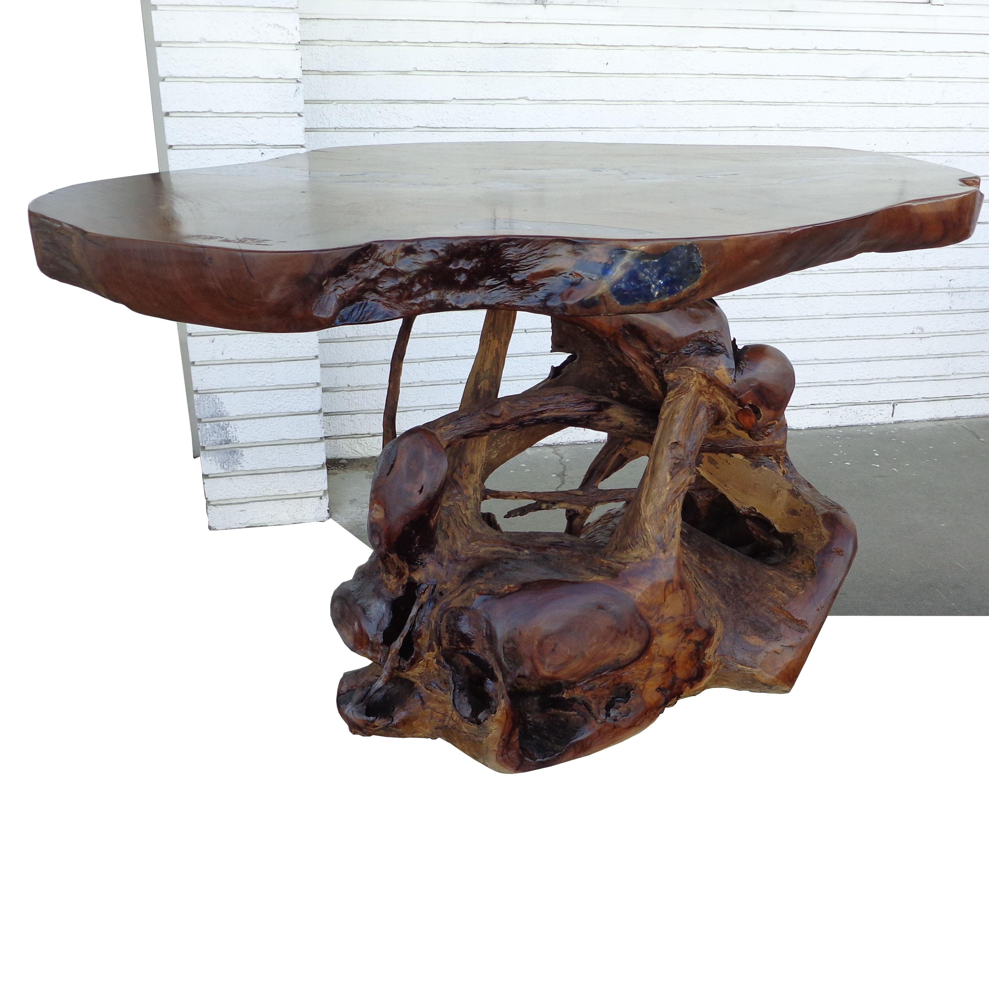 54” live edge glass inlaid dining console table
 
 
California burl root style live edge table with epoxy resin and volcanic rock inlays.

Measures: 54