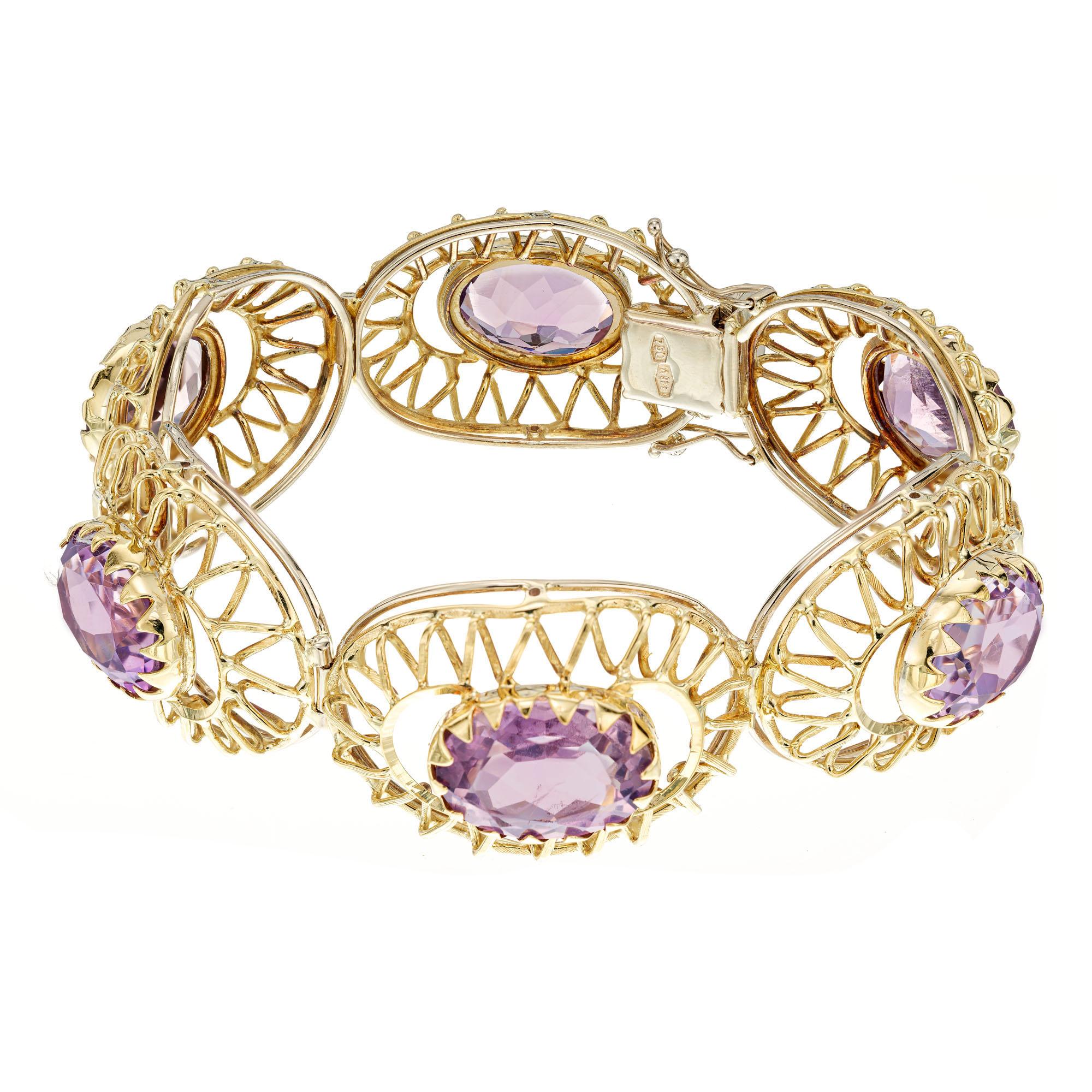 Mid-Century 1950's amethyst bracelet. 6 oval amethysts set in an open work 18k yellow gold bracelet. 7.25 inches in length. 

6 oval Amethyst approx. total weight 5.40cts.
18k yellow gold
Stamped: 750 18k
43.6 grams
Length:  7 ¼ inches
Width: 7/8
