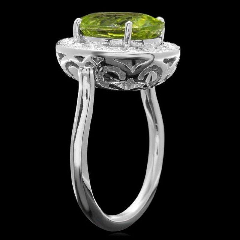 5.40 Carats Natural Very Nice Looking Peridot and Diamond 14K Solid White Gold Ring

Total Natural Oval Cut Peridot Weight is: Approx. 4.80 Carats 

Peridot Measures: Approx. 12 x 10mm

Natural Round Diamonds Weight: Approx. 0.60 Carats (color G-H /