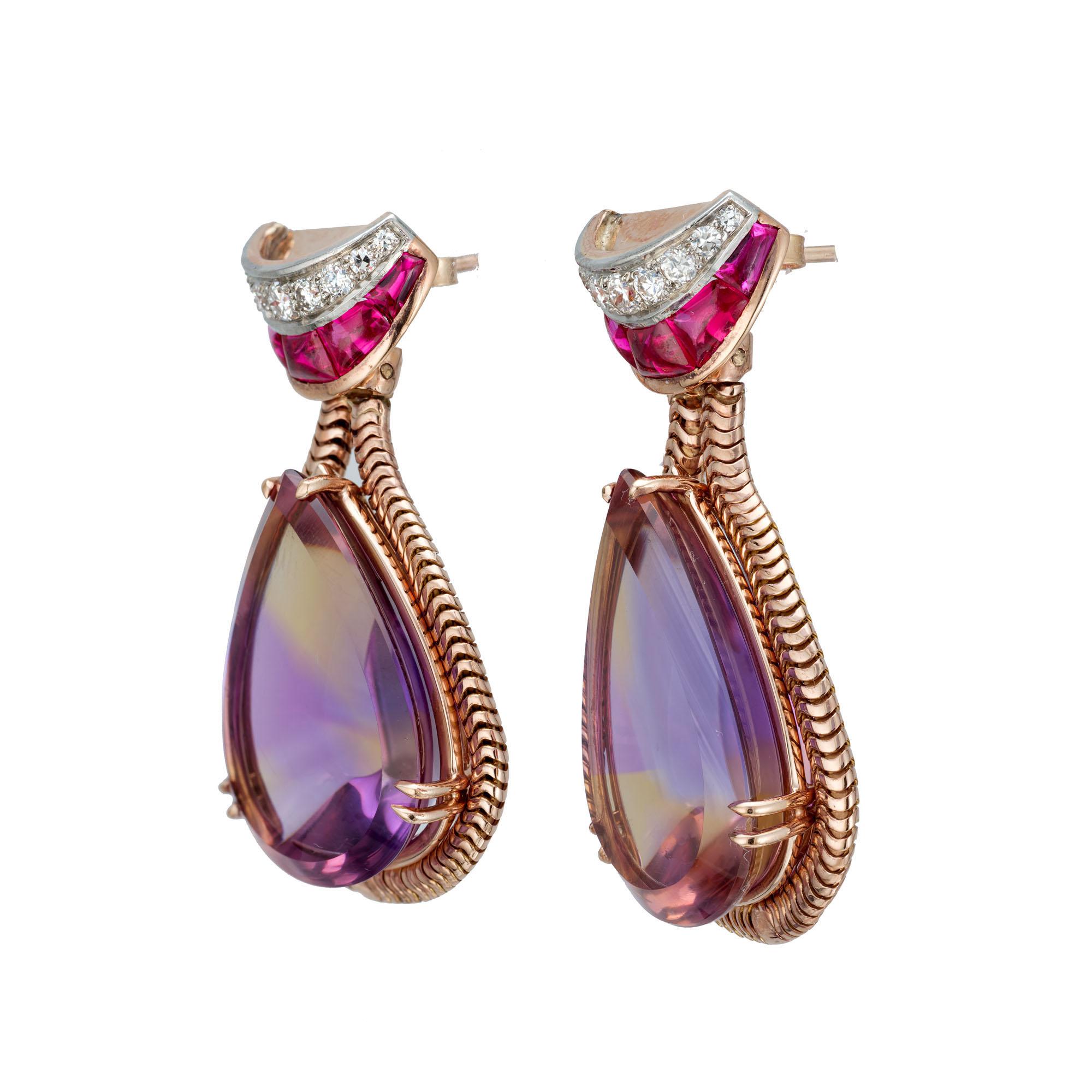 Amethyst, diamond and synthetic ruby dangle earrings. 2 pear shaped Amethyst and citrine stones set in 14k rose gold with 18 round diamonds and 10 red synthetic custom cut rubies at the top.  On Peter's now famous pink gold scale of 1 to 10 with 10