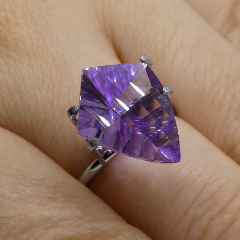 Description:

Gem Type: Amethyst
Number of Stones: 1
Weight: 5.4 cts
Measurements: 16.00 x 12.00 x 7.60 mm
Shape: Shield
Cutting Style Crown: Modified Brilliant
Cutting Style Pavilion: Mixed Cut
Transparency: Transparent
Clarity: Very Slightly