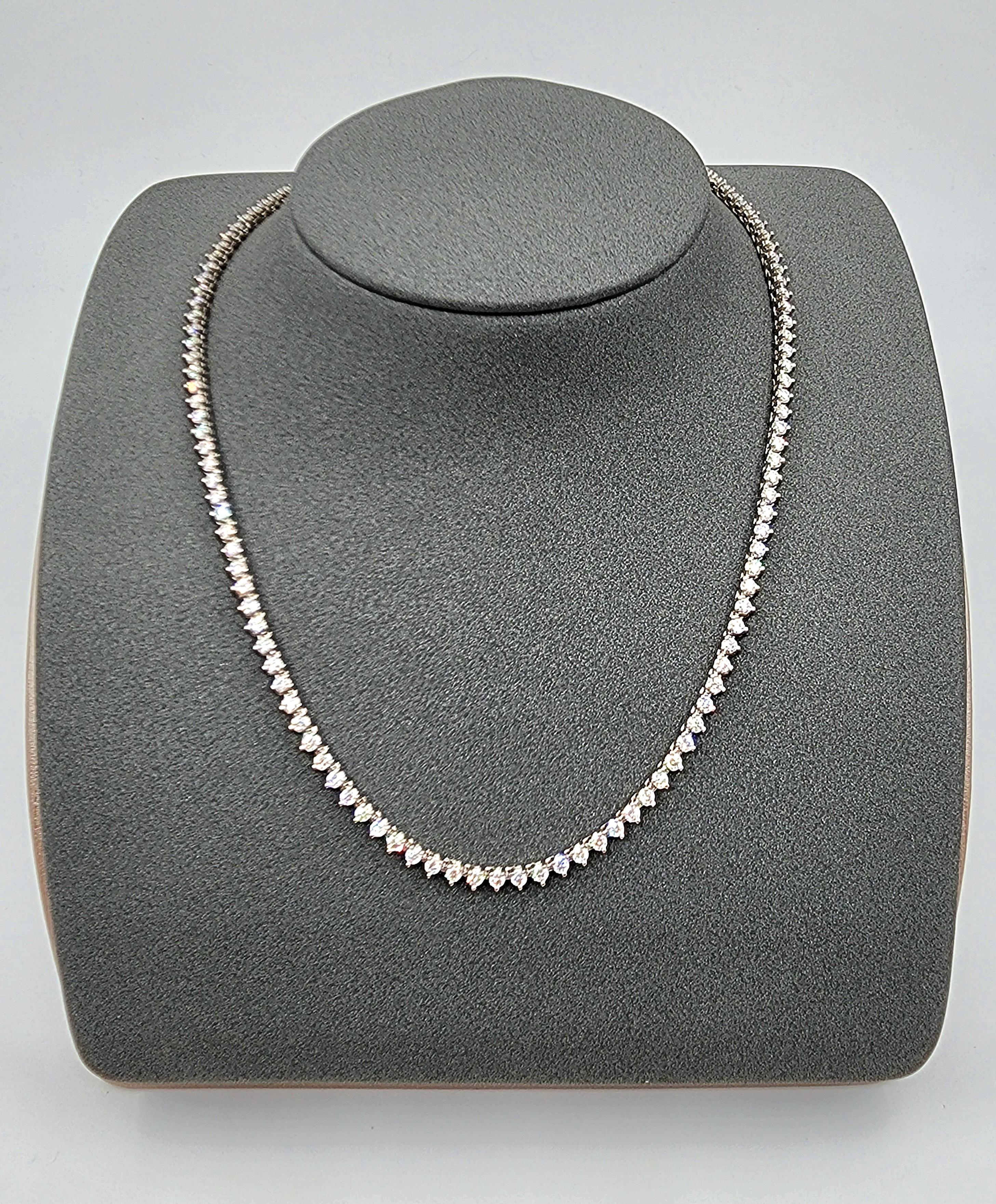 This stunning 5.41 ct diamond tennis necklace has 130 diamonds mounted on 18k white gold. The diamonds boast a color of F/G and VS2/SI1 in clarity. A gorgeous necklace to accompany any wardrobe.