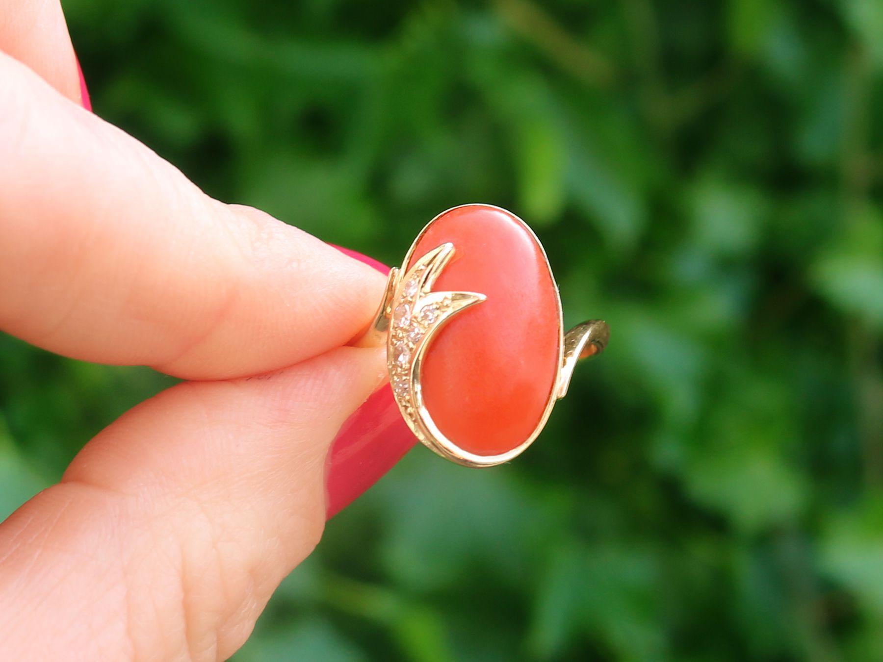 An impressive vintage 1980s 5.42 carat coral and 0.18 carat diamond, 14 karat yellow gold cocktail ring; part of our diverse vintage jewelry and estate jewelry collections.

This fine and impressive vintage cabochon cut gemstone ring has been