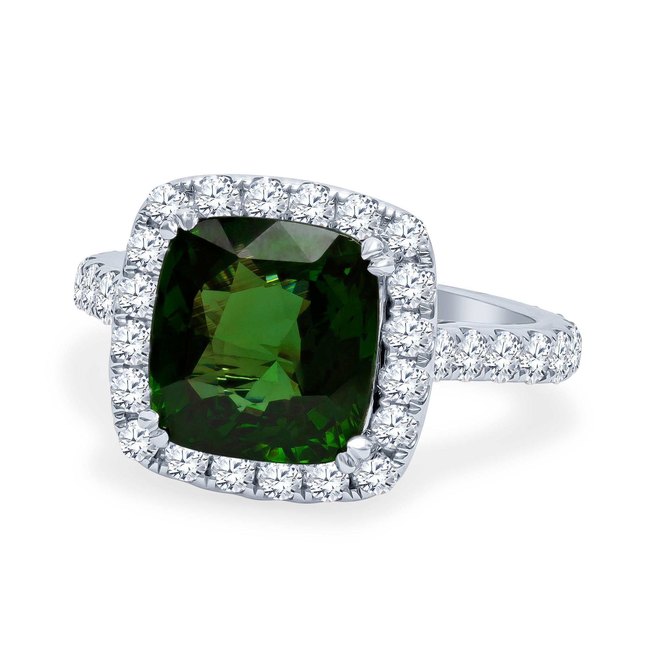 18K white gold large cushion shape halo ring set with one 5.42 Carat total weight cushion cut green zircon ring with 0.52 carats total weight of split prong-set round brilliant diamonds. Ring size 7, may be adjusted larger or smaller upon request.