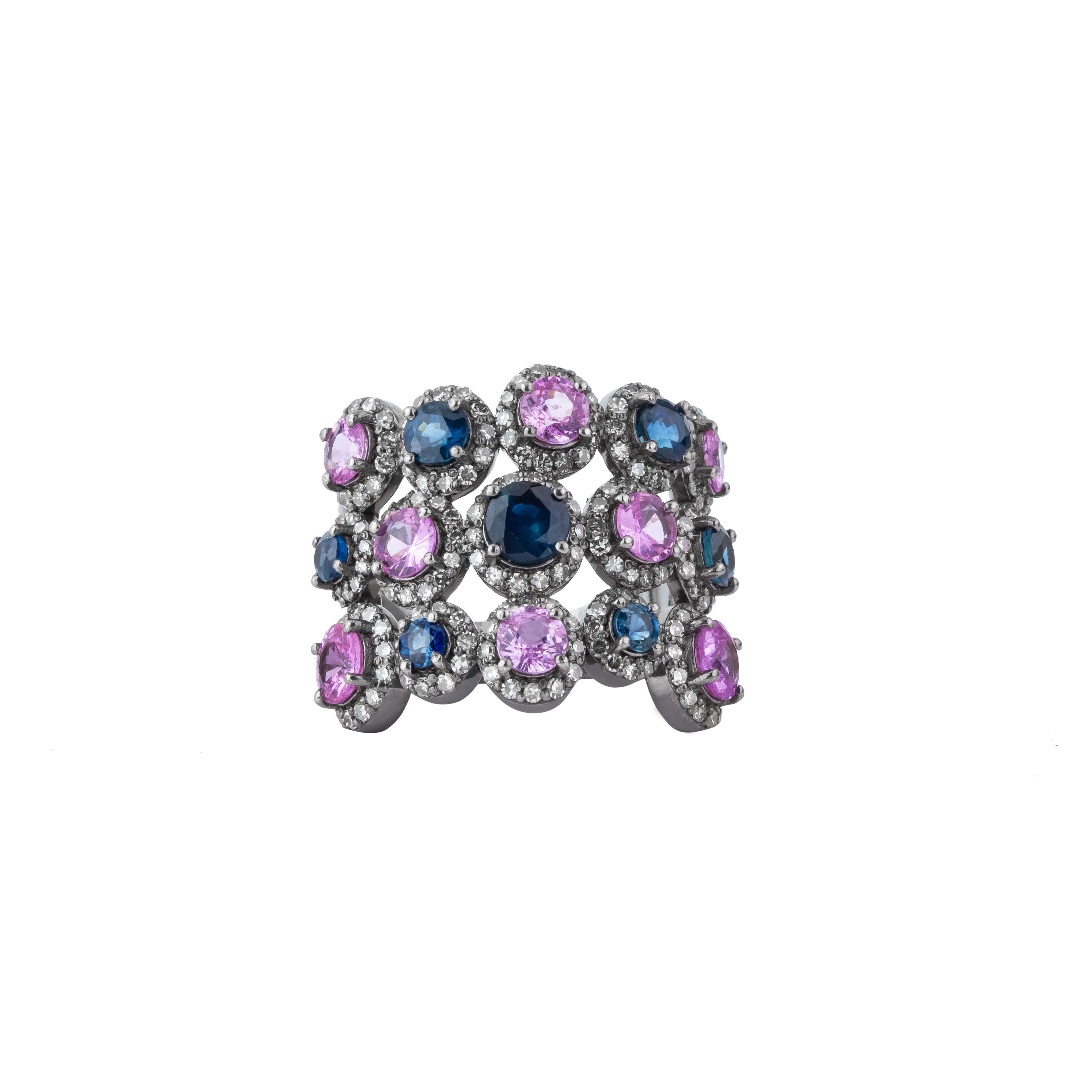 The 5.42 Carat Diamond and Multi Sapphire Band Ring embodies a vibrant symphony of color and brilliance, crafted with impeccable attention to detail. This extraordinary piece features an array of multi-colored sapphires, each meticulously selected