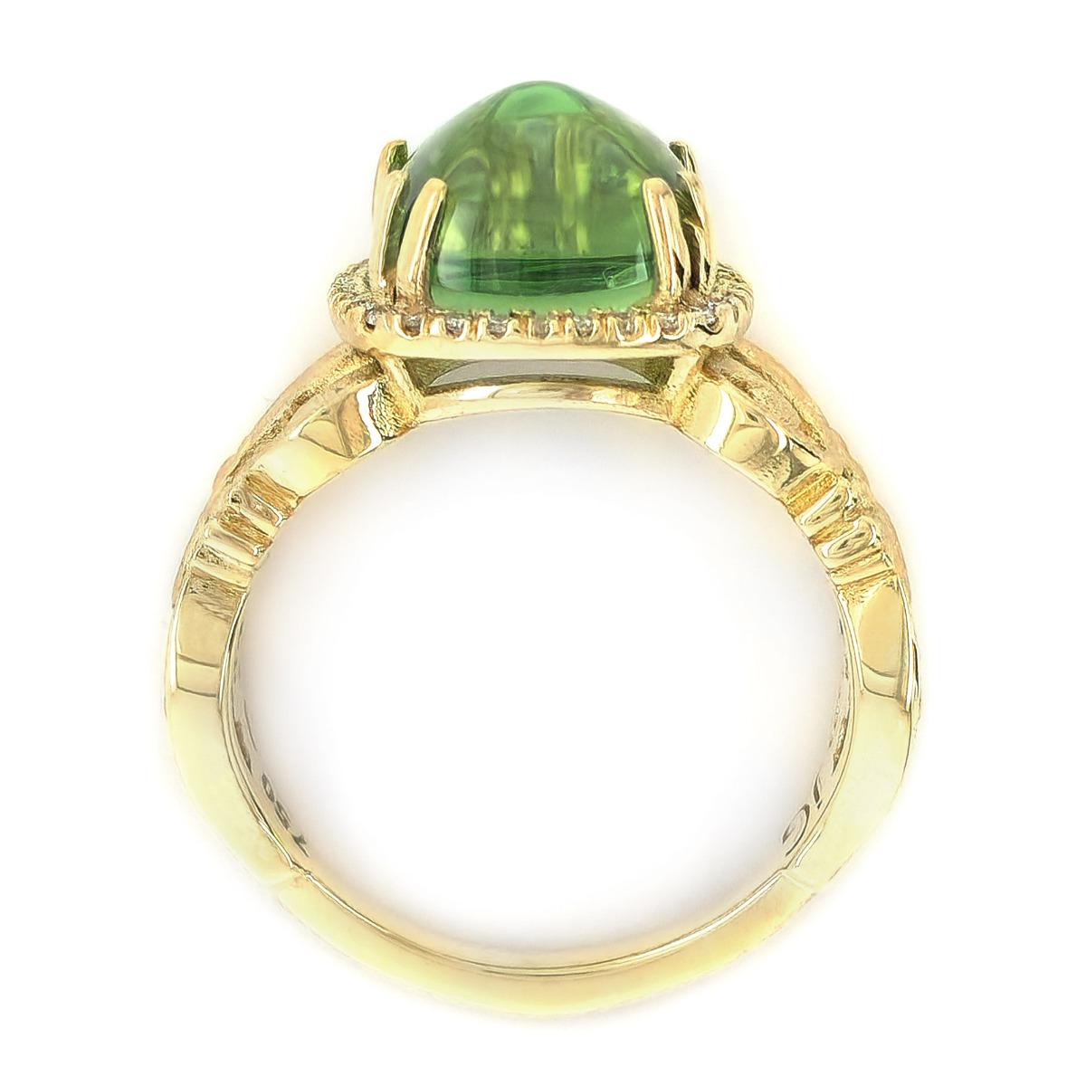 Tourmaline, symbolizing friendship and wealth, finds its embodiment in this exquisitely crafted 5.42-carat gemstone. The cabochon cut enhances the grandeur of the gemstone, bringing it to life. Complemented by perfectly matched diamonds, this ring