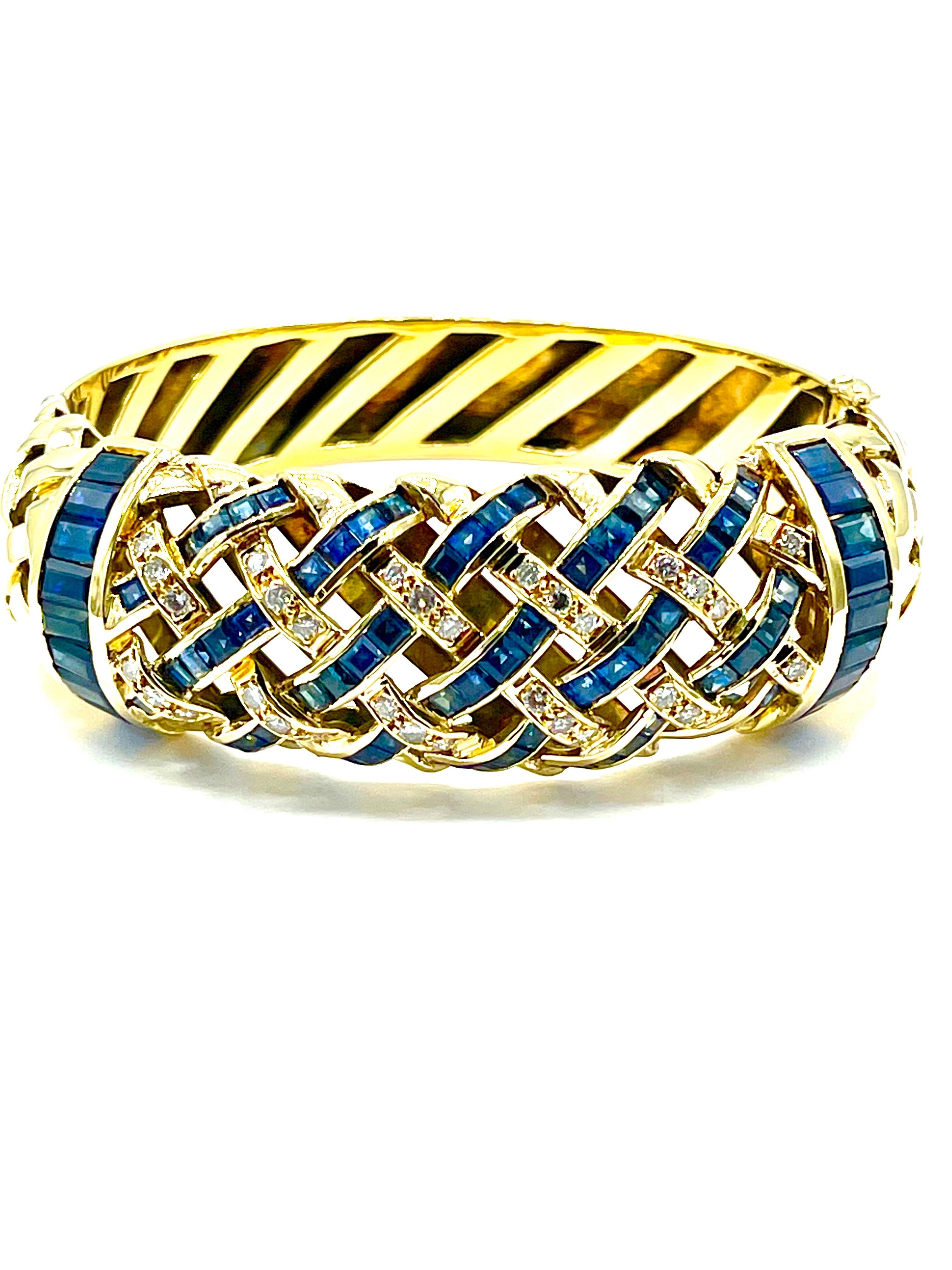 A beautifully made Sapphire and Diamond cuff bracelet.  The bracelet is designed in a basket weave pattern on the top half, with Sapphires and Diamonds overlapping one another, and two large channel set Sapphire bars on each side, set in 18K yellow