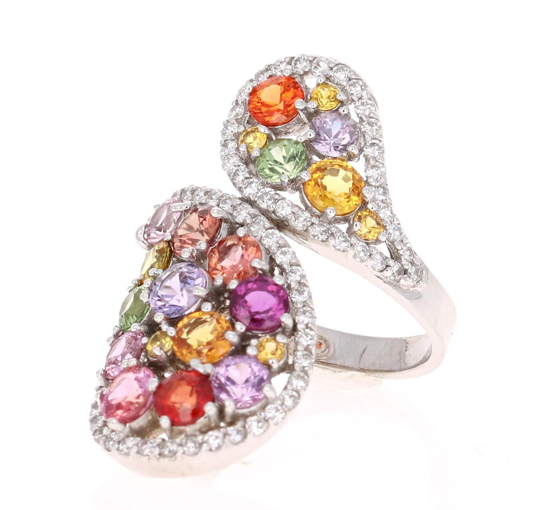 Super gorgeous and uniquely designed 5.43 Carat Multi-Colored Sapphire and Diamond 14K White Gold Cocktail Ring!

This ring has a cluster of 22 Round Cut Multi-Colored Sapphires that weigh 4.65 carats and 73 Round Cut Diamonds that weigh 0.78 carats