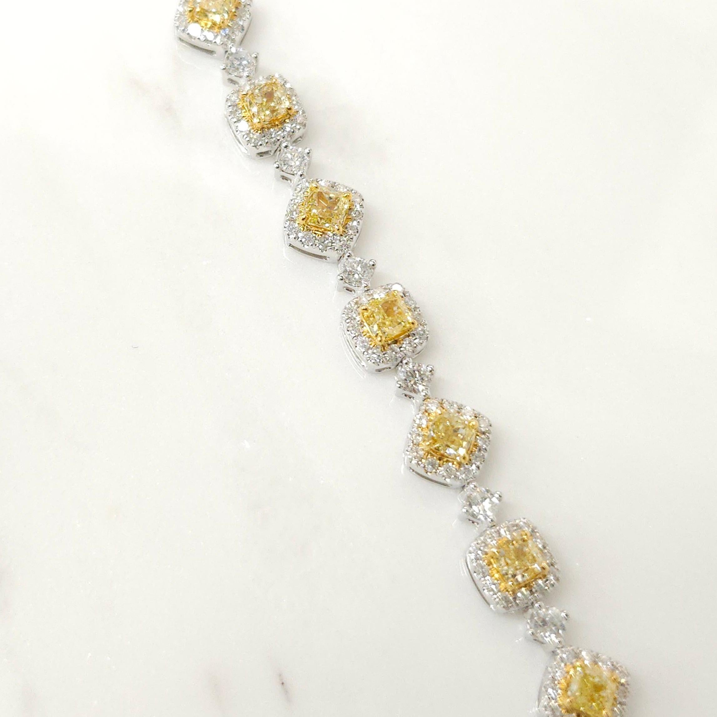 Get ready to be amazed by this stunning bracelet featuring a dazzling 3.48 carat of cushion-cut fancy yellow diamonds at the heart of it. Each yellow diamond is lovingly cradled in 18K white and yellow gold frames, with a surrounding halo of 208