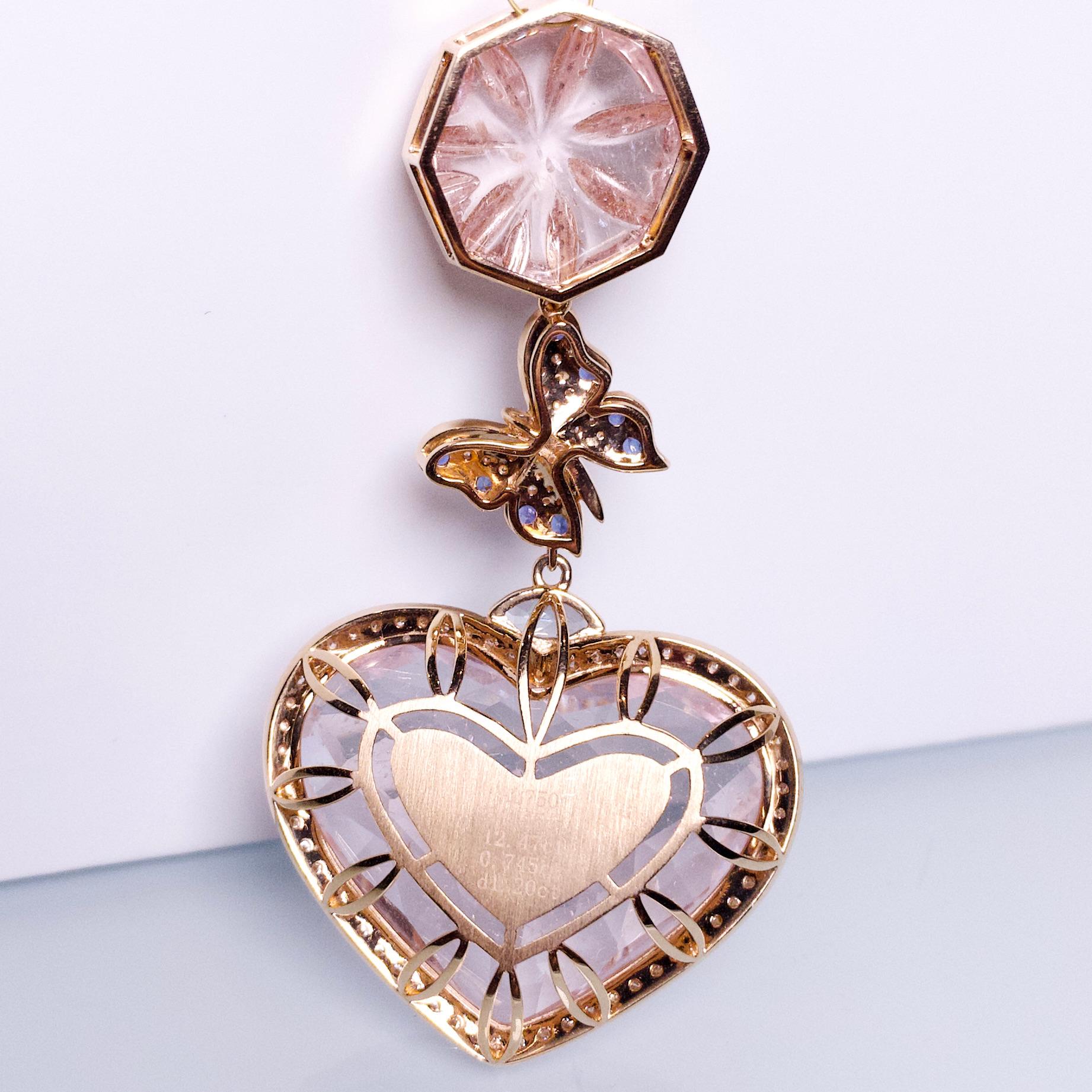This is a massive statement pendant as it consists of a 54 ct Heart shape Morganite and a 12 ct Morganite cabochon. The Heart Shape Morganite is surrounded by diamond pave and is suspended below a butterfly motif encrusted in Diamonds and Blue