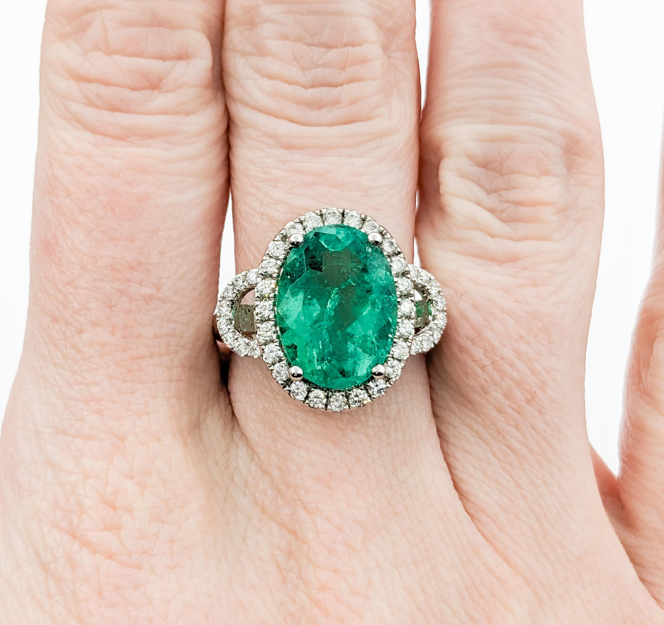 Oval Cut 5.44ct Emerald & .59ctw Diamonds Ring In White Gold For Sale