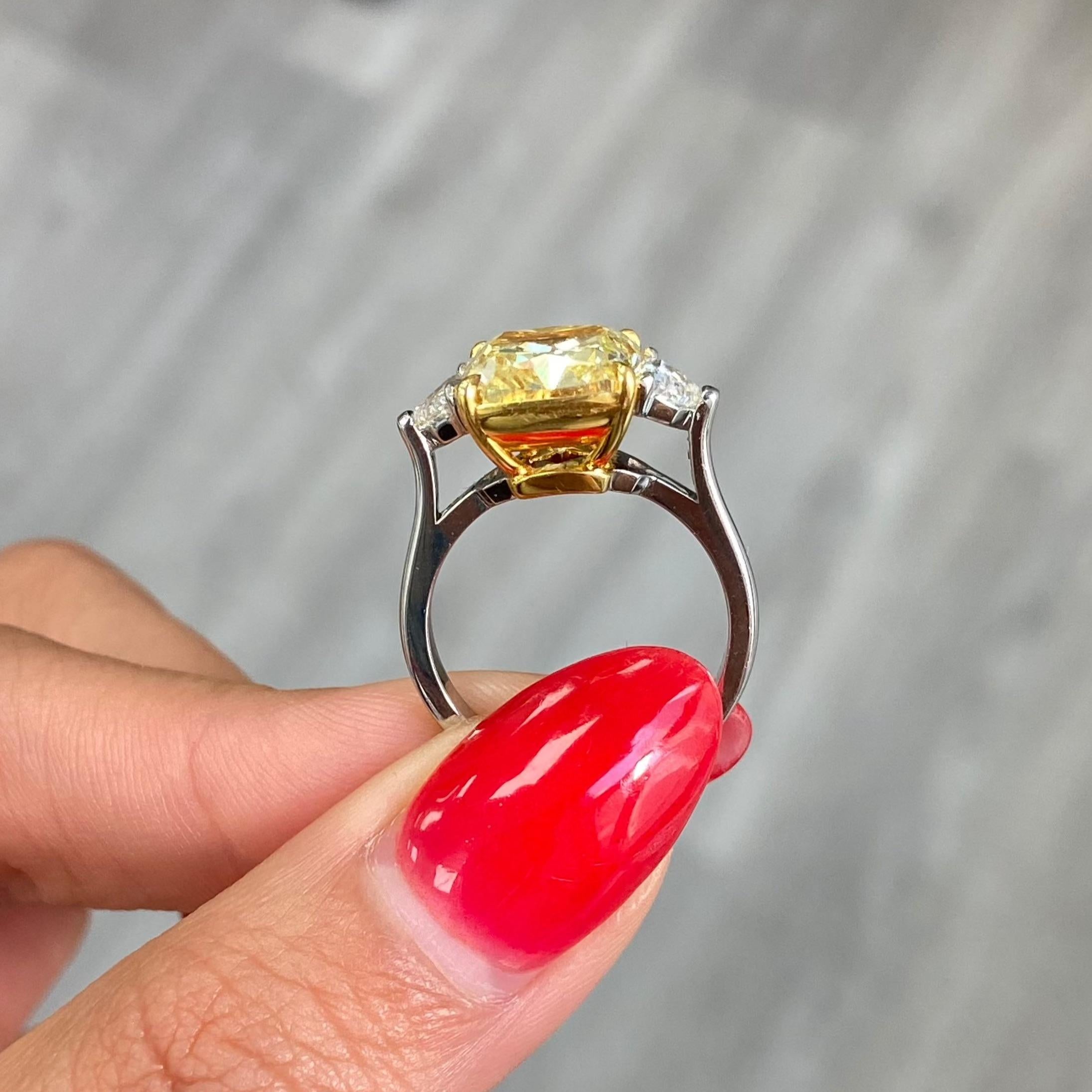 5.44ct Fancy Yellow Cushion Diamond Three Stone Ring In New Condition In New York, NY