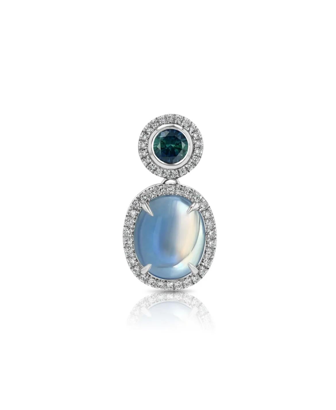 18K white gold pendant, featuring a 5.44ct rainbow moonstone, paired with a 0.63ct Montana sapphire, accented by 0.33ct round brilliant-cut diamonds.