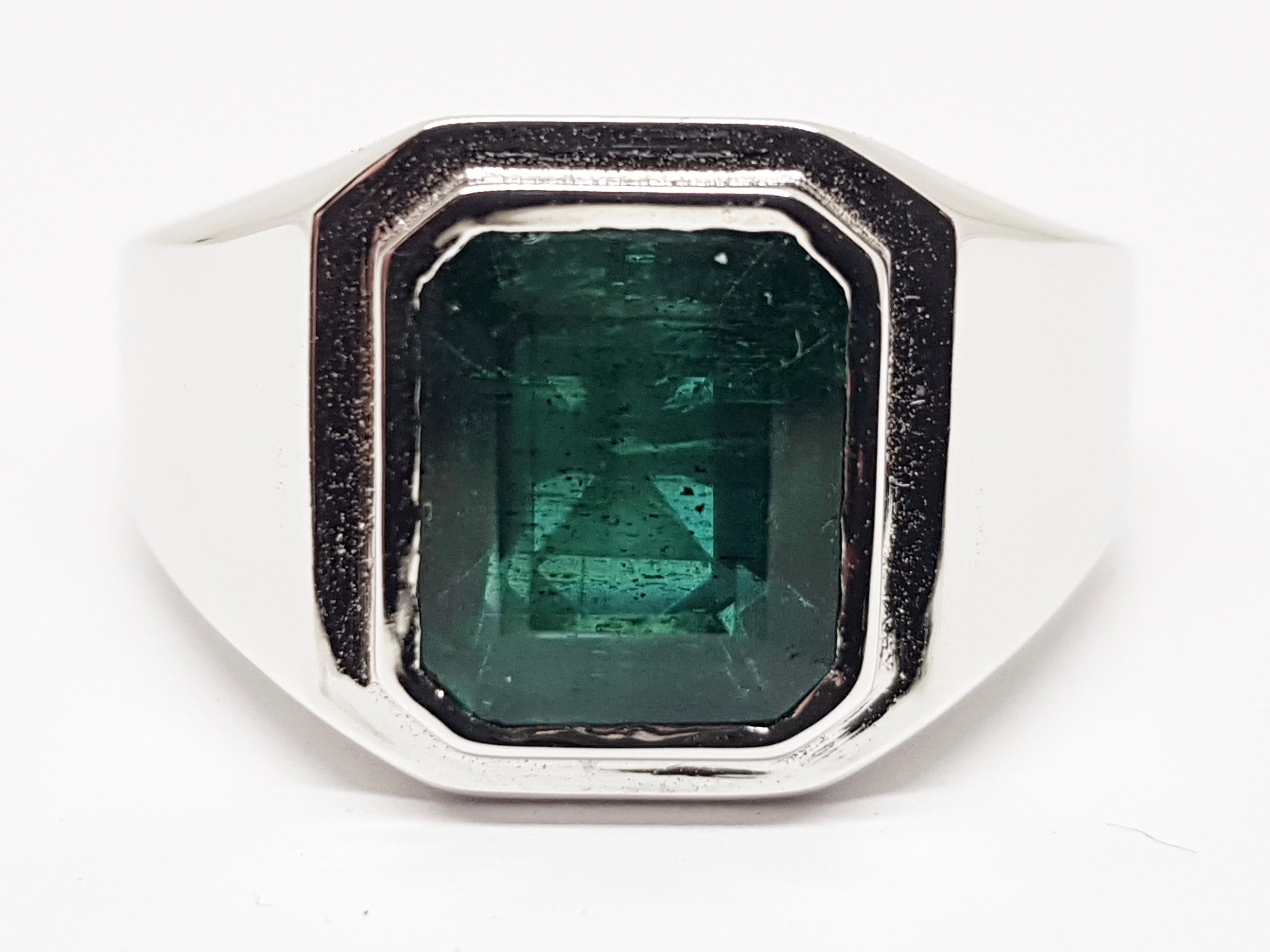 Gold: 18 carat white gold 
Weight: 14.14gr. 
Emerald: 5.45 ct. DEEP GREEN TRANSPARENT Origine: Zambia
IGI Certificate Number: 371974249
Width: 1.5cm. 
Ring Size: BE 69 NL 22mm US 12.5
Free resizing up to size 77 / 24mm 
Shipping: free worldwide