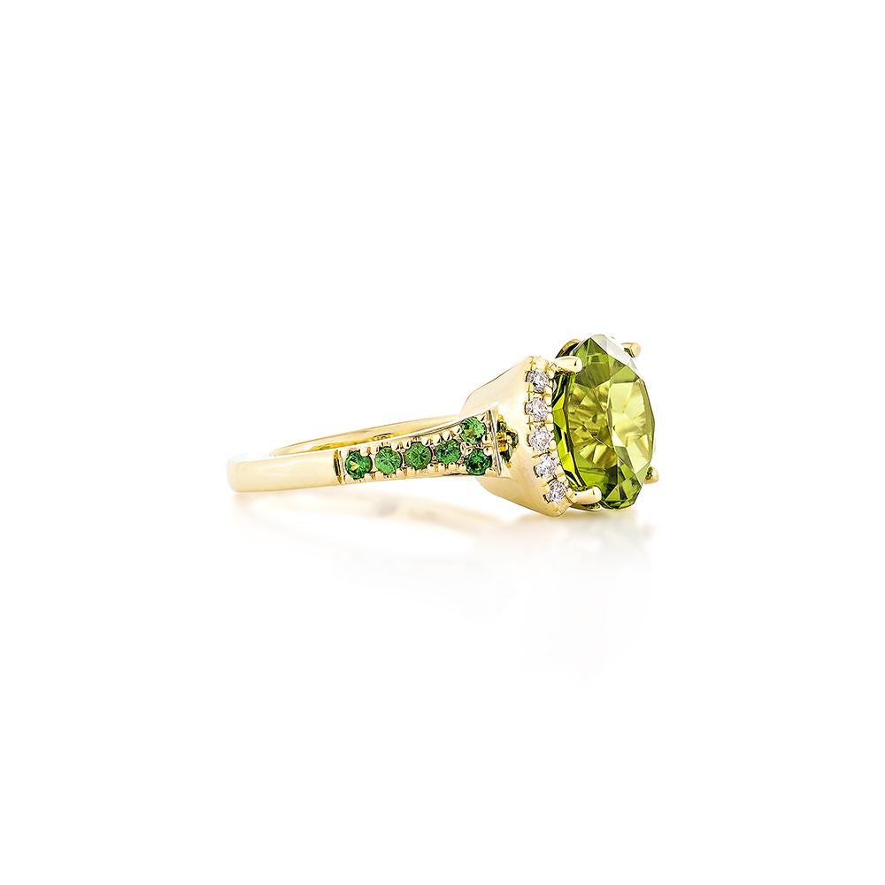 This collection features a selection of the most Olivia hue peridot gemstone. Uniquely designed this ring with tsavorite and diamonds in yellow gold to present a rich and regal look.

Peridot Fancy Ring in 18Karat Yellow Gold with Tsavorite and