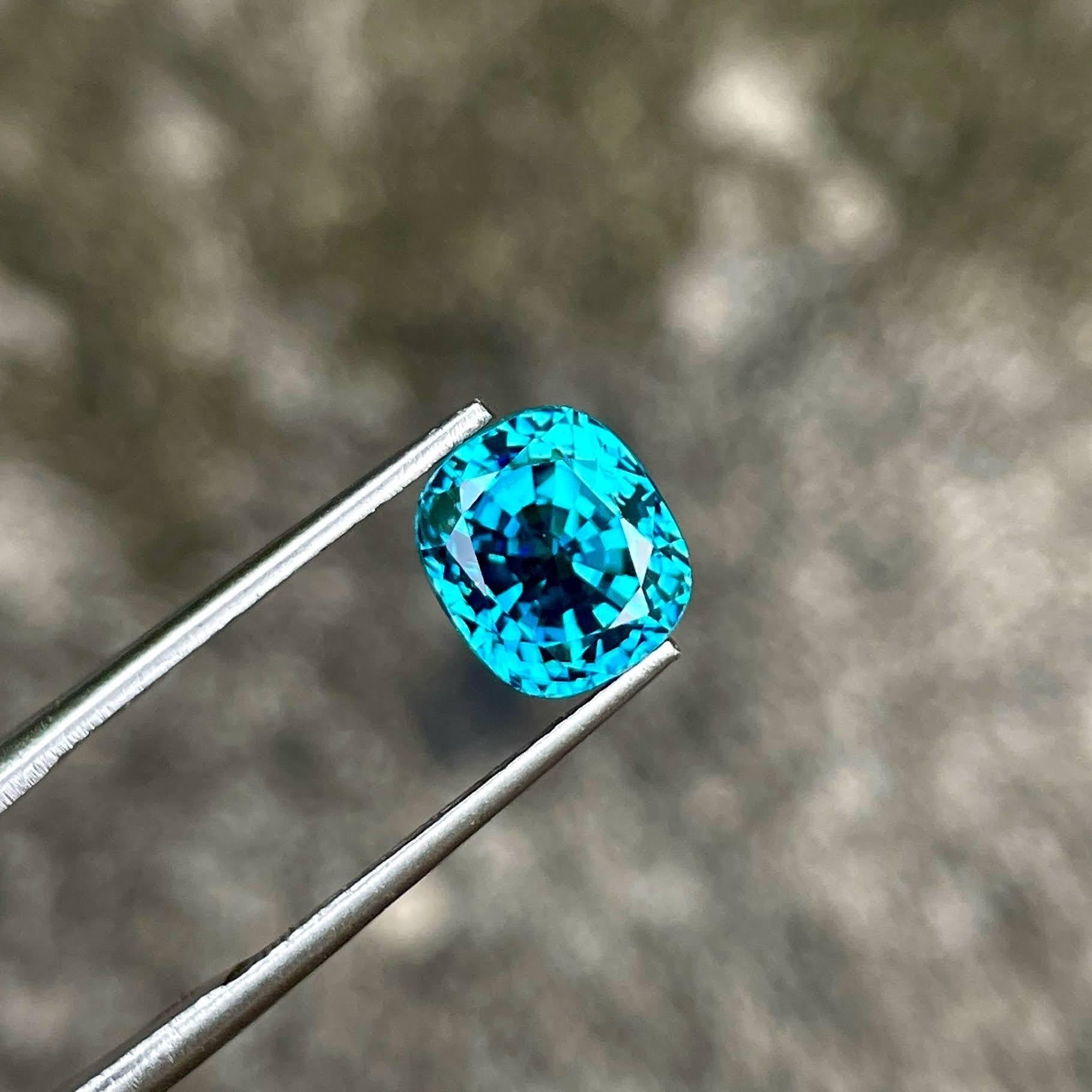 Weight 5.45 carats 
Dimensions 8.7x7.7x7.0 mm
Treatment Heated 
Origin Cambodia 
Clarity VVS
Shape cushion 
Cut fancy cushion 



This exquisite 5.45 carat Blue Zircon gemstone is a stunning example of natural beauty, sourced from the rich lands of