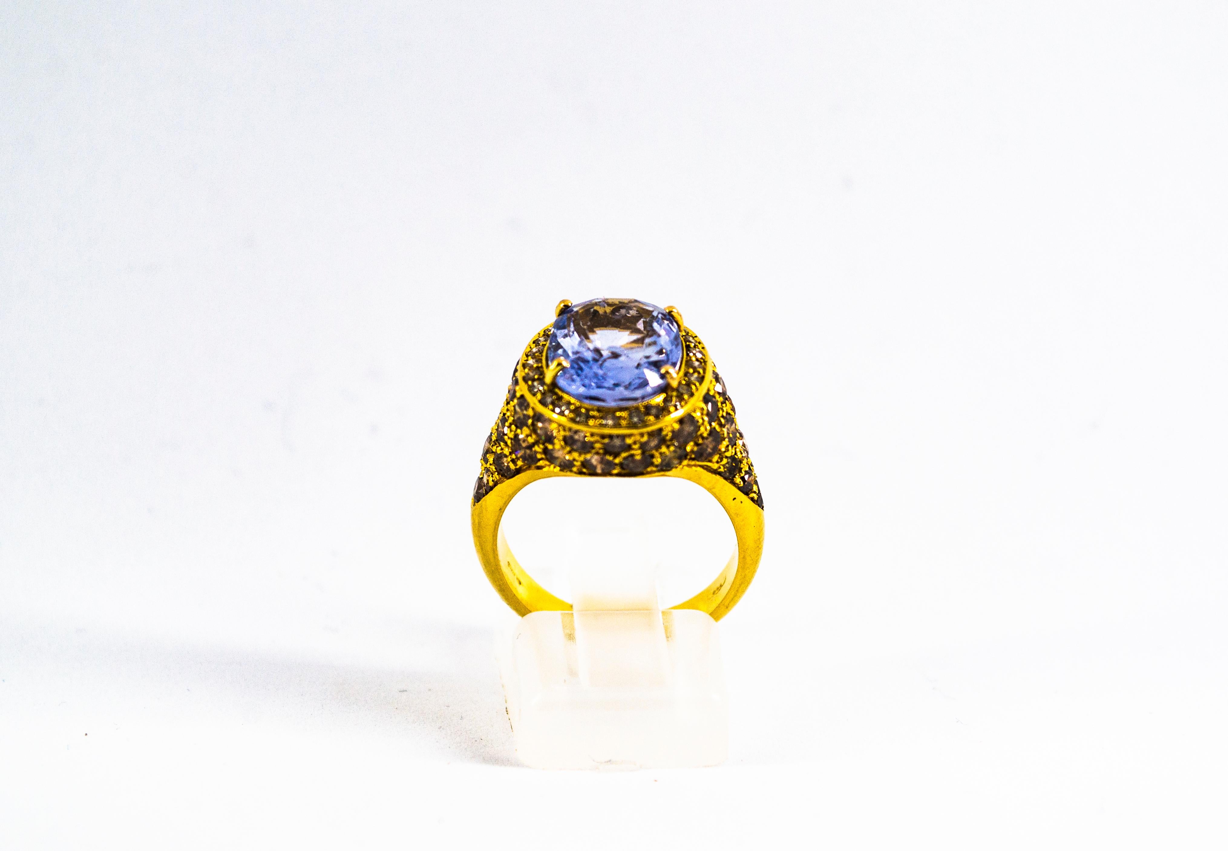 This Ring is made of 18K Yellow Gold.
This Ring has 2.80 Carats of Brown Modern Round Cut Diamonds.
This Ring has a 5.46 Carats Blue Oval Cut Sapphire.
This Ring is available also with a central Emerald.
Size ITA: 13 USA: 6.5
We're a workshop so