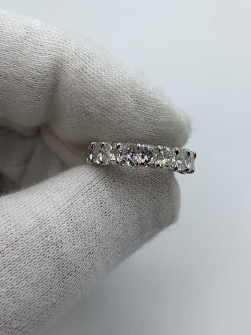 Contemporary 5.46 Carat Cushion Cut Eternity Band Ring For Sale