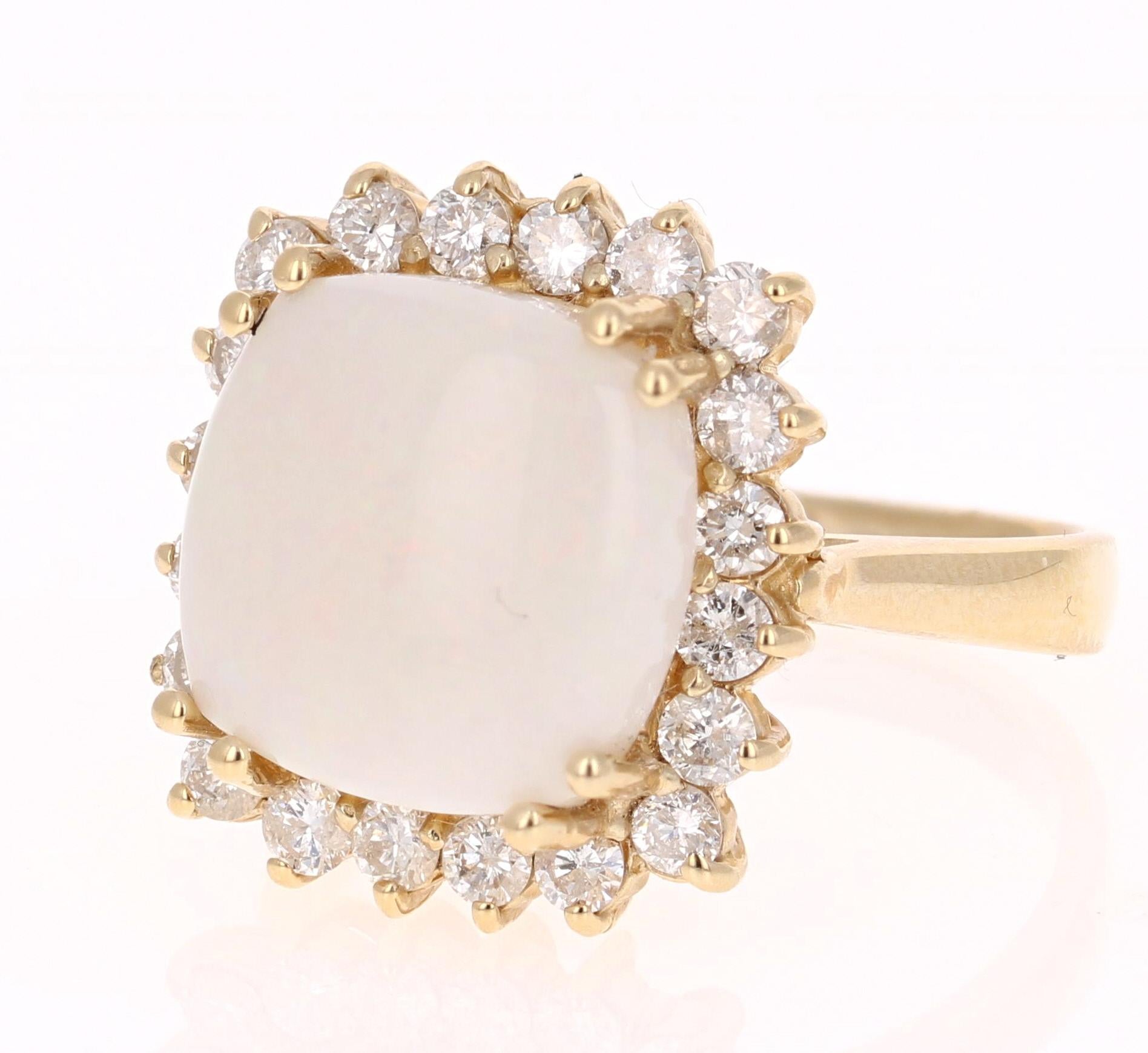 A unique and beautiful ring to add to your collection! Opal Lovers will particularly love the characteristics of this ring.
This ring has a Cushion Cut Opal that weighs 4.54 carats and is surrounded by 20 Round Cut Diamonds that weigh 0.92 carat. 