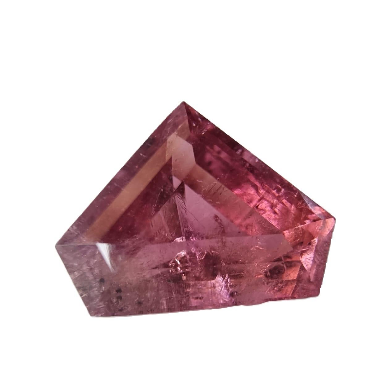 Immerse yourself in the enchantment of our exquisite 5.46ct Custom Cut Purple Red Rubellite Tourmaline Loose Gemstone. This gemstone boasts a rare Pentagon Cut, emphasizing its captivating Purple Red Rubellite Tourmaline variety.

Detailed