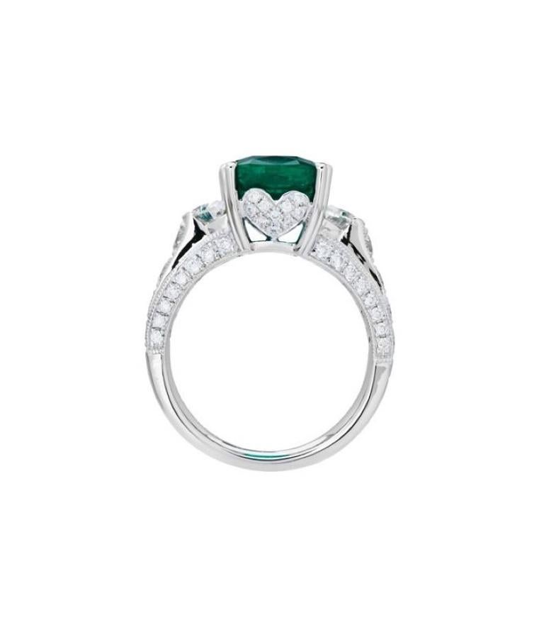 One of a kind 5.47 Carat Cushion Cut Colombian Emerald and Diamonds in Gold.

*RING* One (1) eighteen karat (18kt) white gold Colombian Emerald and Diamond ring featuring; One heart prong set cushion cut genuine Colombian Emerald weighing
