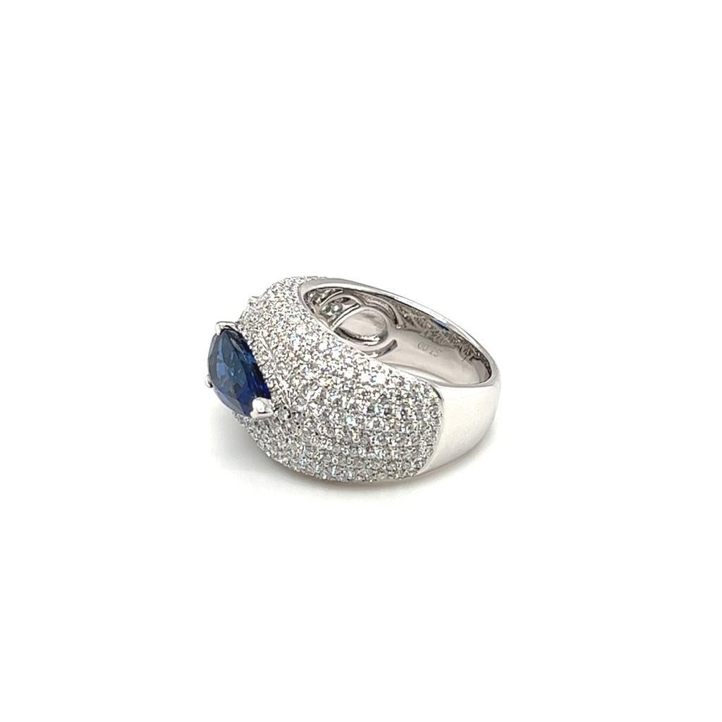 This stunning 3.00 carats Pear-shaped Sapphire and Diamond Ring is just simply beautiful. This remarkable piece features with 3 different shapes of Diamond set on 18 Karat White Gold.  One Pear shaped Sapphire as the main stone with two Marquise