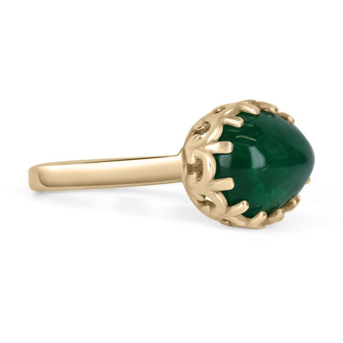 A bezel-set emerald cabochon 14K gold ring. Featured here is this lovely 5.47-carat natural, earth-mined emerald cabochon. This stone displays a gorgeous, dark green color, and very good luster. This natural beauty is set in a 14K yellow gold bezel