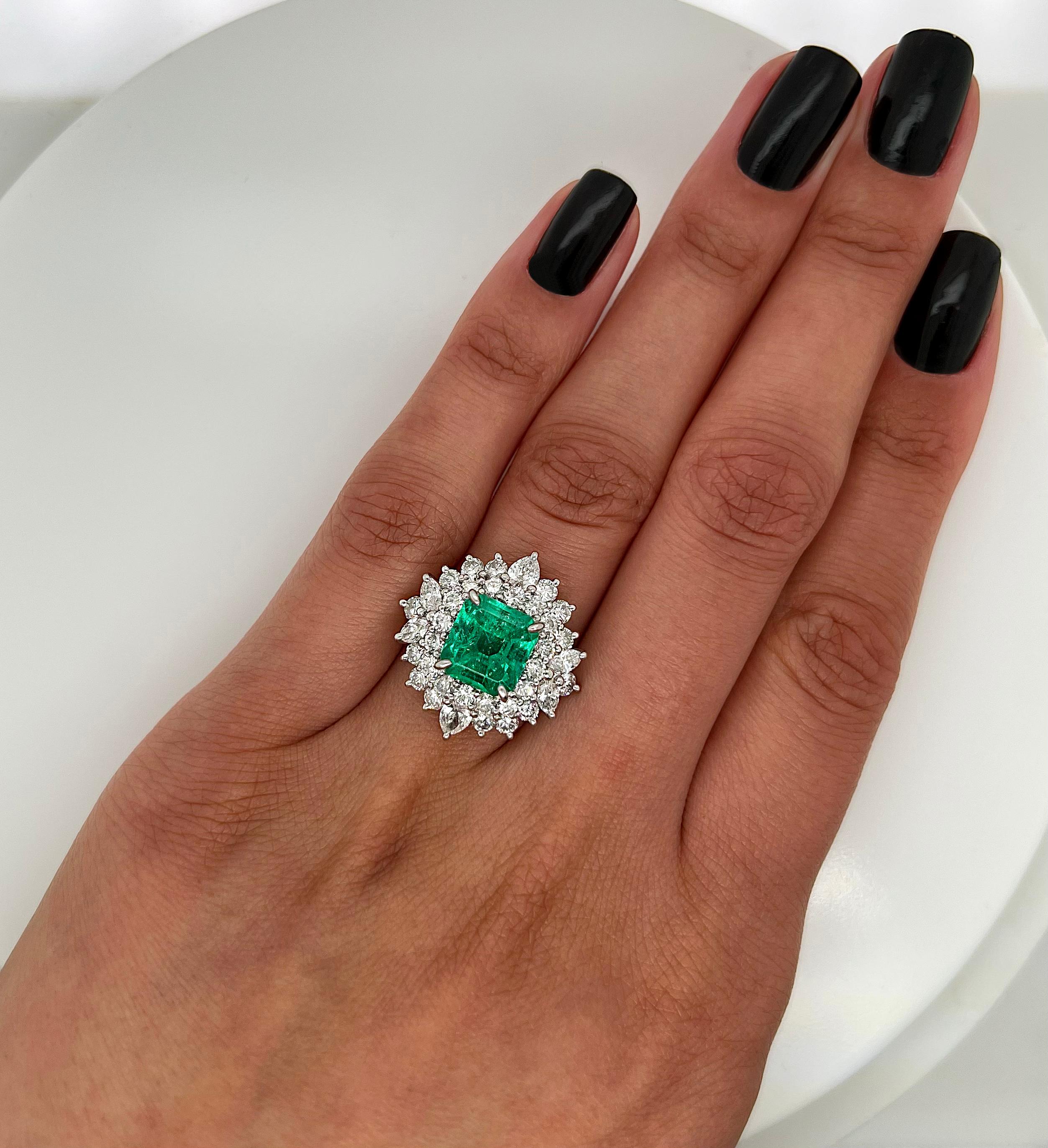 5.48 Total Carat Emerald and Diamond Halo Ladies Ring In New Condition For Sale In New York, NY