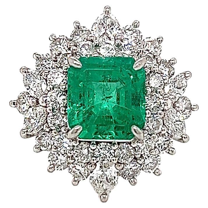 5.48 Total Carat Emerald and Diamond Halo Ladies Ring For Sale