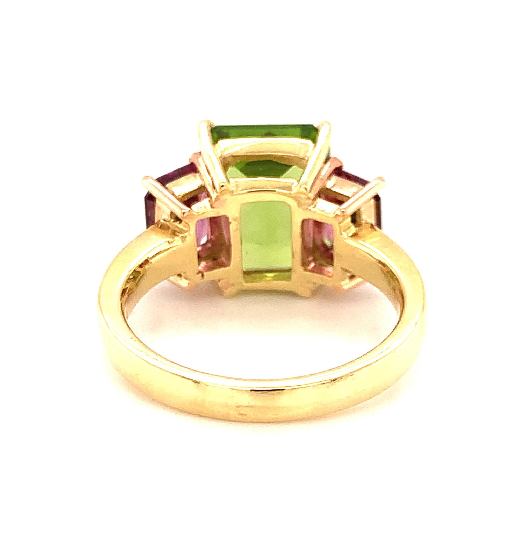 Women's 5.49 Carat Peridot and Rhodolite Garnet Three-Stone Ring in Yellow and Rose Gold For Sale