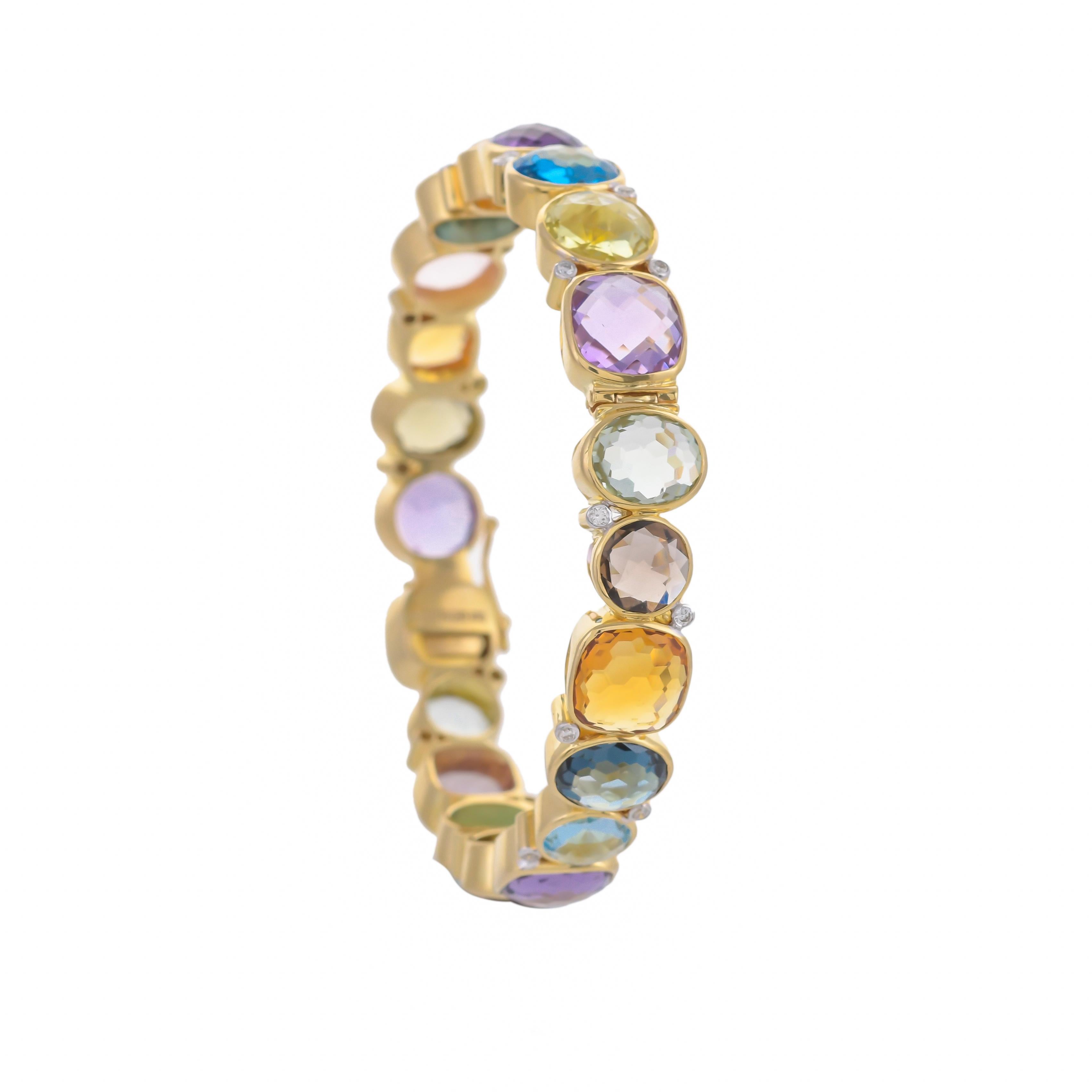 This statement bangle is styled with 54.96 carats multi-colored briolette which are meticulously set in 18 karats yellow gold, further enhanced with vertically set 0.41 carats white diamonds highlights the beauty of this chic yet timeless piece.
Art