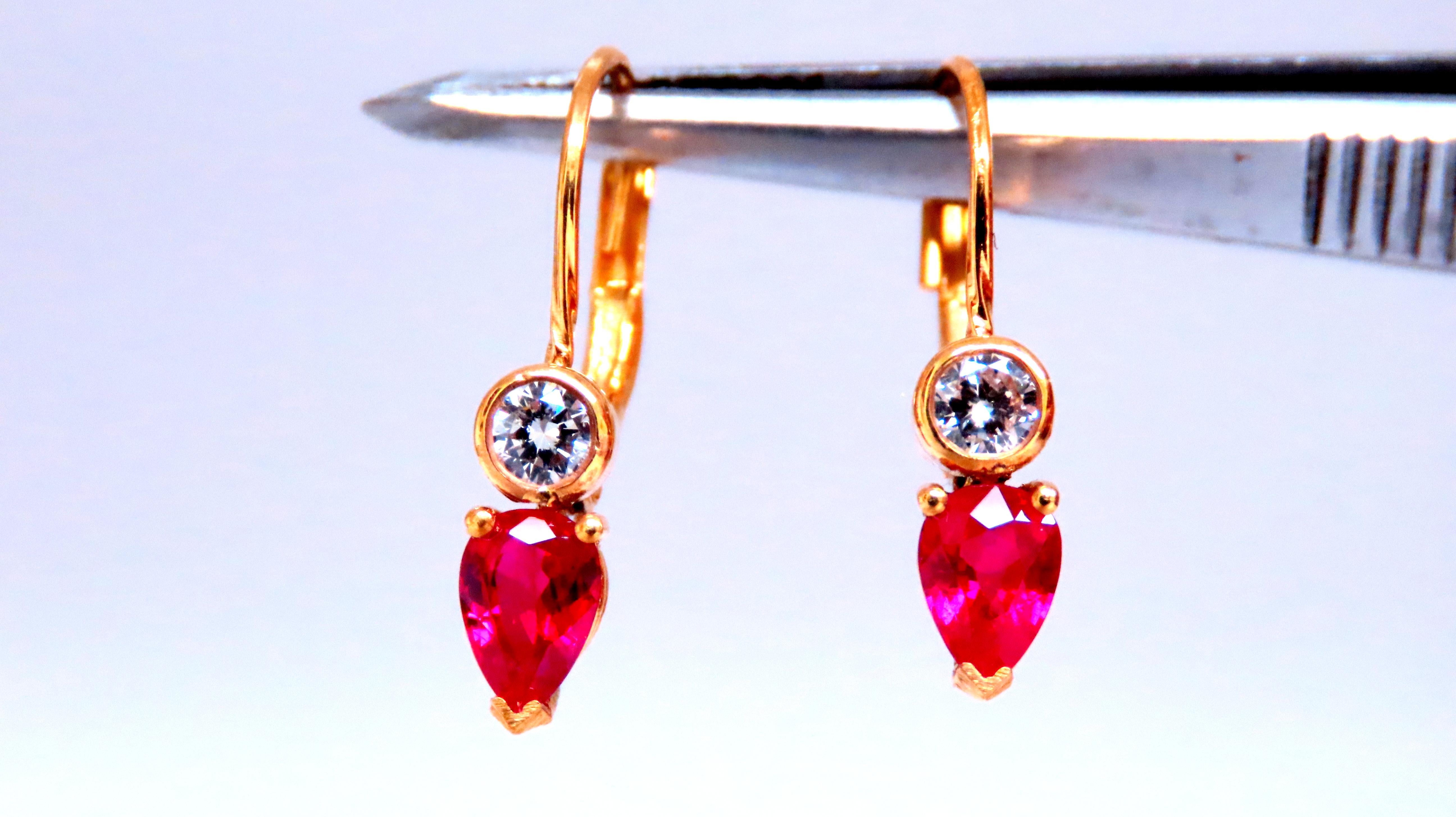 Natural Ruby Diamond Earrings
.54ct Pear Shaped Ruby
Clean Clarity Transparent
.20ct Natural Diamonds.
G-color Vs-2 clarity.
14kt. yellow gold
1.9 grams
earrings 3/4 inch long