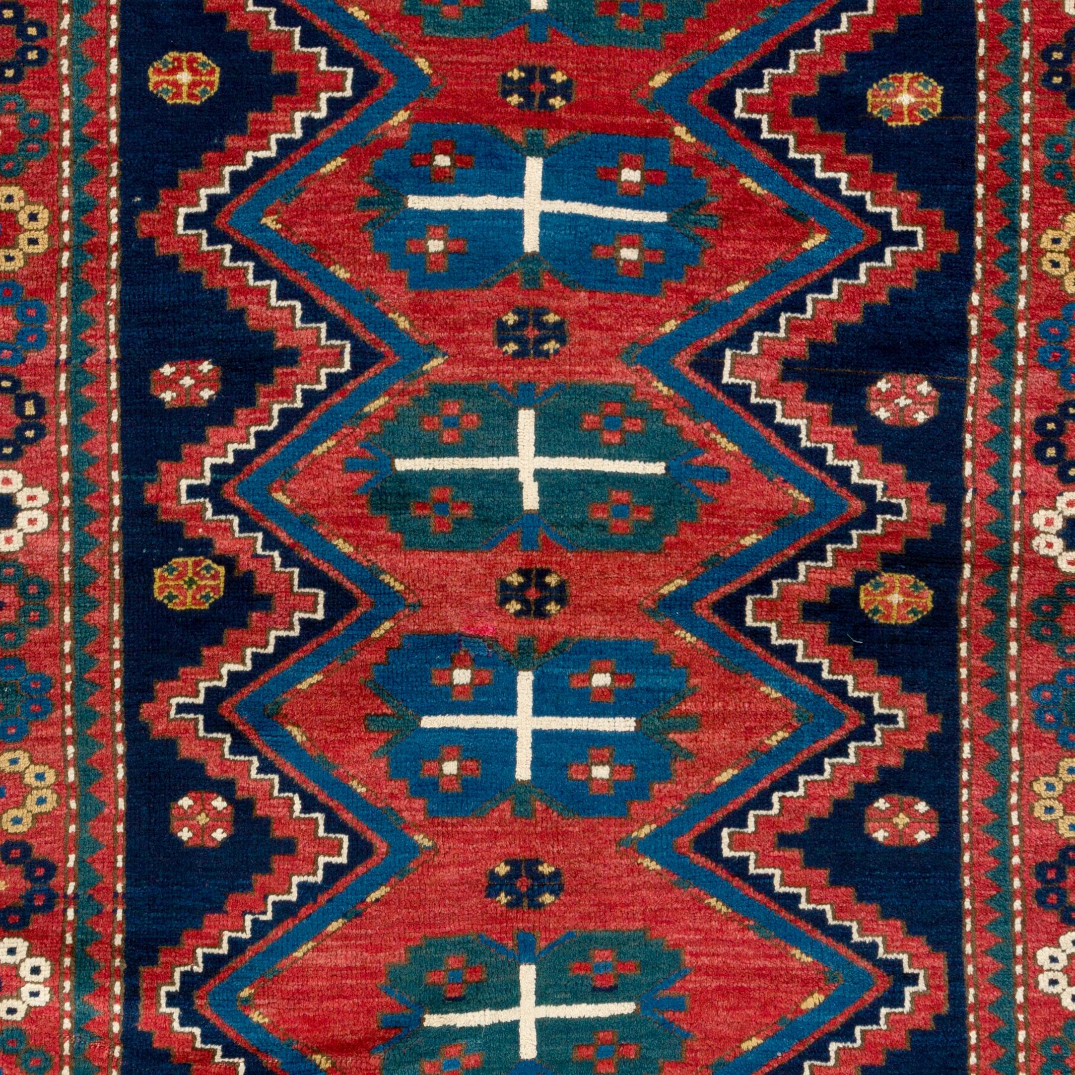 An antique Caucasian Kazak rug. 
Finely hand-knotted with even medium wool pile on wool foundation. 
Very good condition. Sturdy and as clean as a brand new rug (deep washed professionally).
