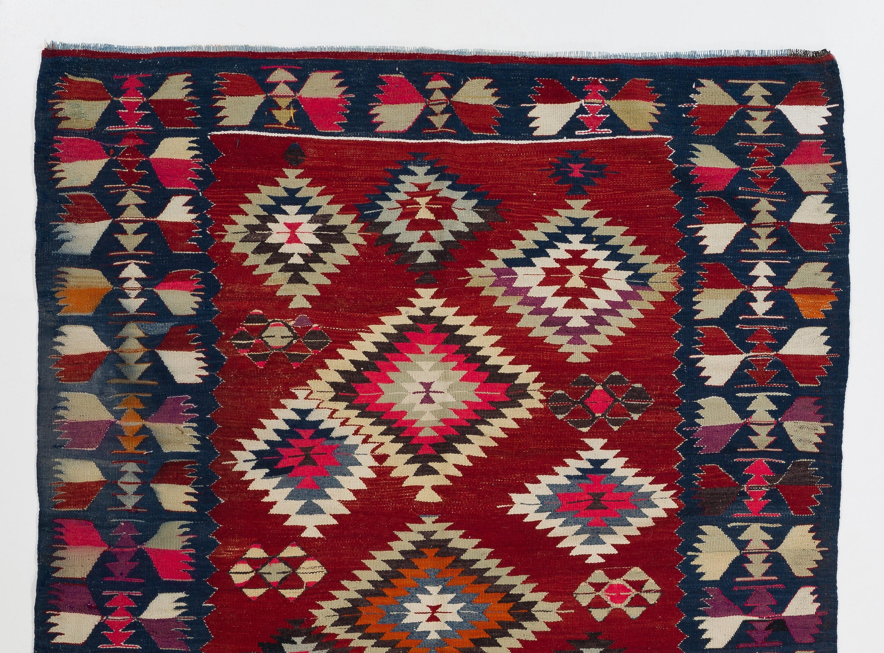 A colorful vintage Turkish Kilim. A flat-weave rug made of wool in excellent condition. 

This captivating Kilim features stepped diamond patterns nestled within each other, free-floating all-over the field in varying sizes and beautiful, rich,