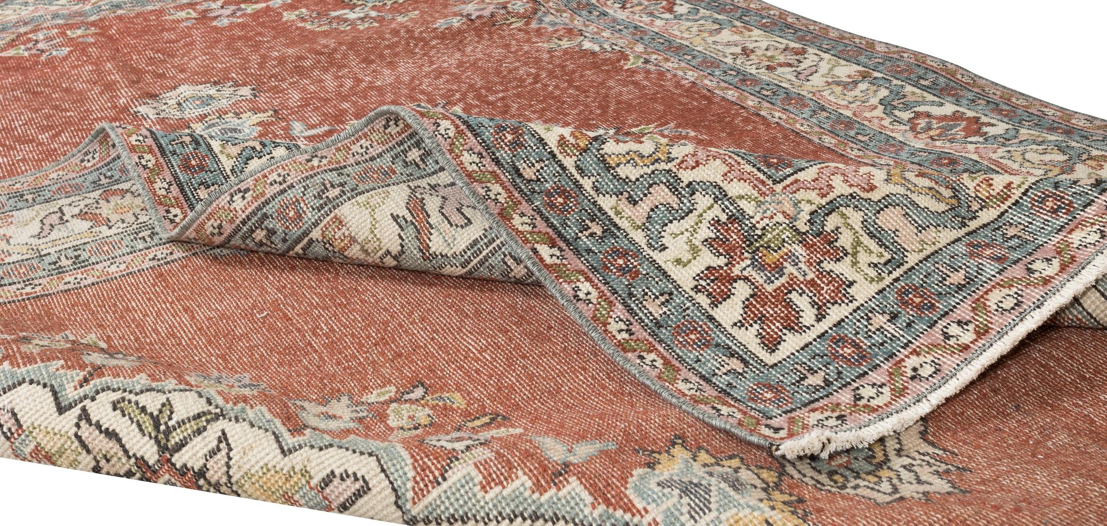 A finely hand-knotted vintage Central Anatolian rug from 1960s. The rug has even low wool pile on cotton foundation. It is heavy and lays flat on the floor, in very good condition with no issues. It has been washed professionally, The rug is sturdy