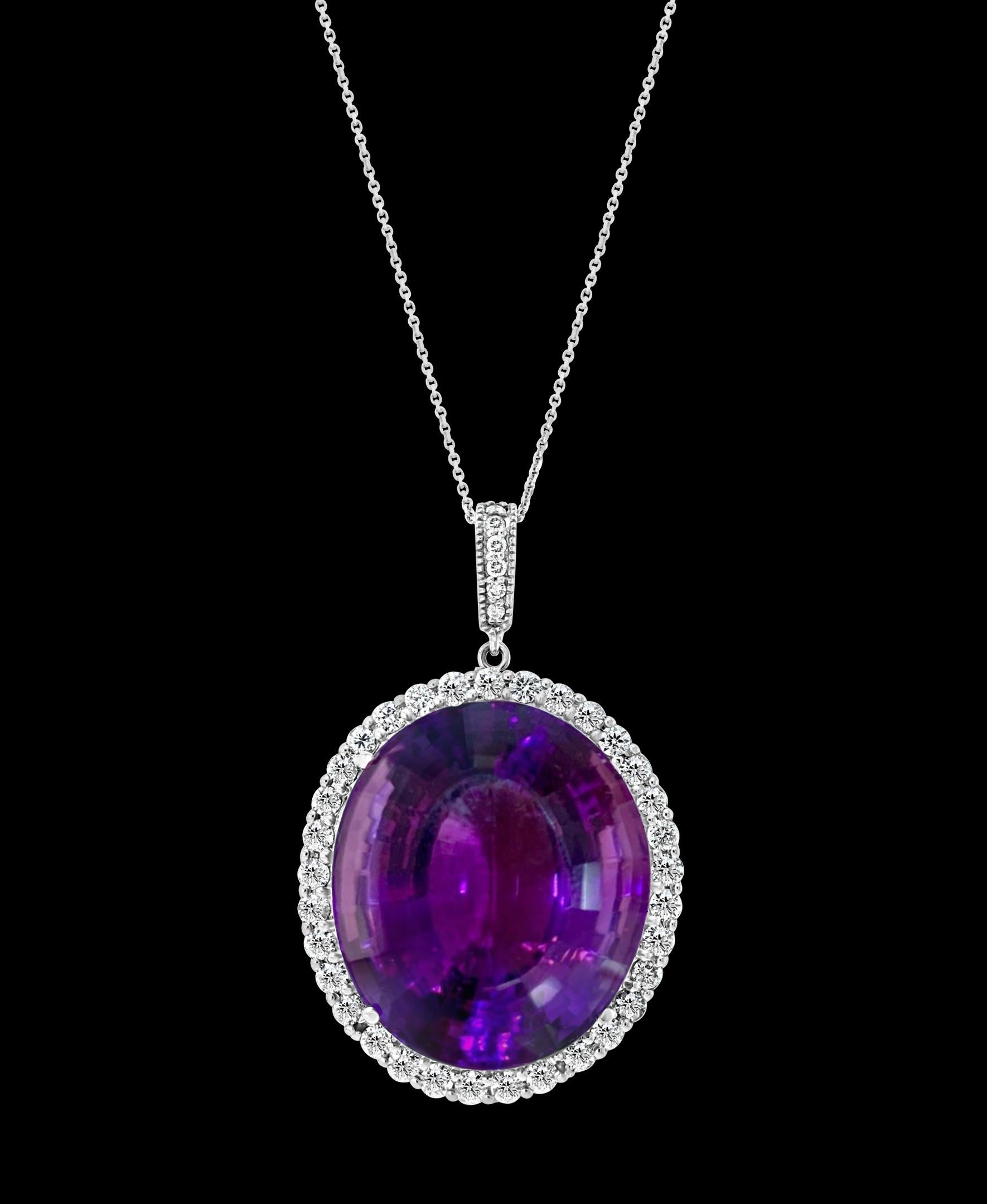    55 Carat Amethyst & 2 ct Diamond Pendant Necklace 14 Karat White Gold + Chain
This spectacular Pendant Necklace  consisting of a single large Oval Amethyst , approximately  55 Carat.  The  Amethyst  has Circle of diamonds around it . Diamonds on