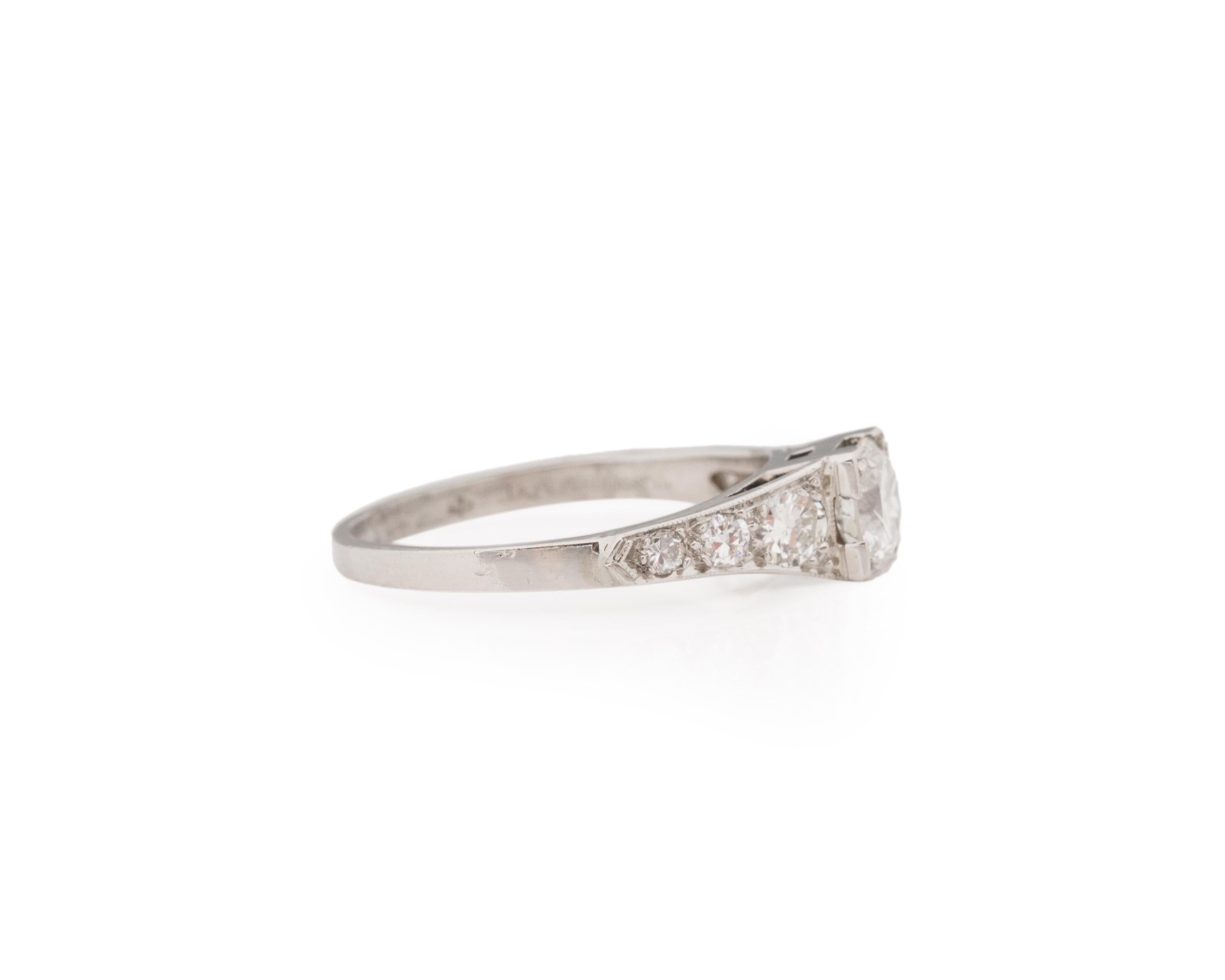 Ring Size: 5.5
Metal Type: Platinum [Hallmarked, and Tested]
Weight: 3.0 grams

Center Diamond Details:
Weight: .55ct
Cut: Old European brilliant
Color: F
Clarity: VS

Finger to Top of Stone Measurement: 5mm
Condition: Excellent
