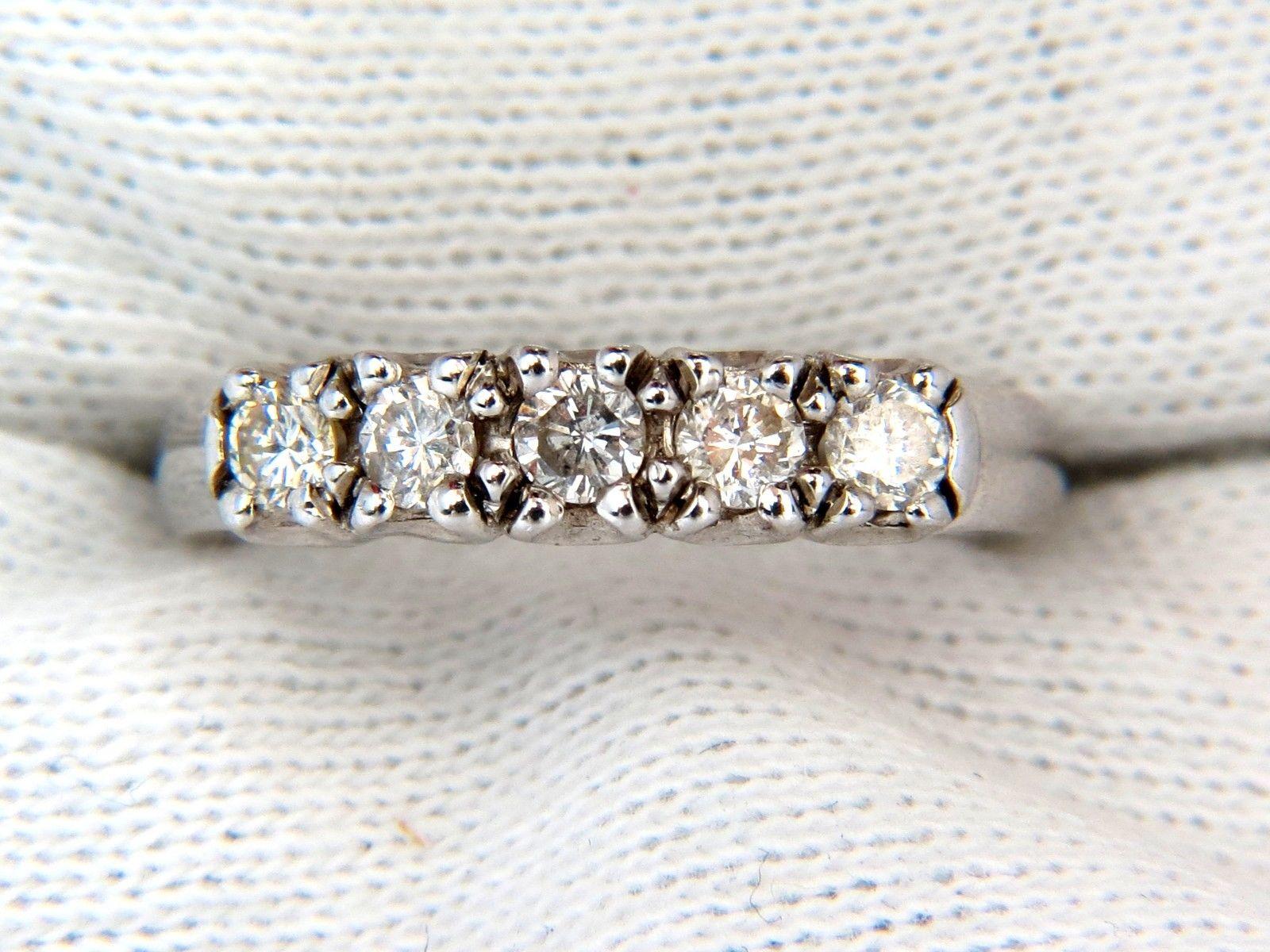 Modern Band

.55ct. Round diamonds

H-color Vs-2 clarity

4.21mm wide

 size: 6

3.9 grams

can resize, please inquire

$2500 appraisal will accompany