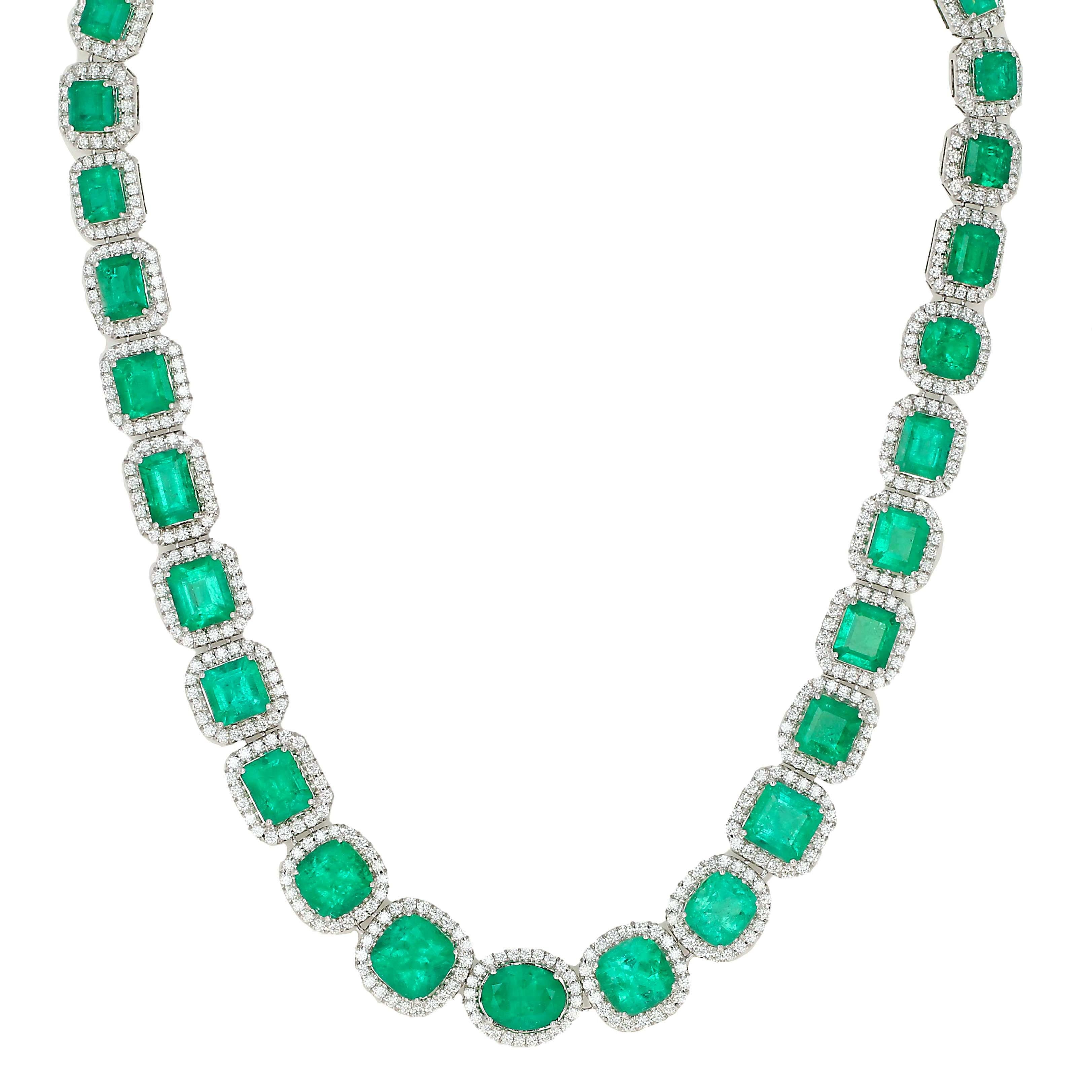 A one-of-a-kind impressive emerald and diamond necklace. A vibrant, bold, and vivid emerald and diamond necklace crafted from 18 karat white gold. This necklace exudes luxury and sophistication, featuring 35 natural emeralds varying in shape and