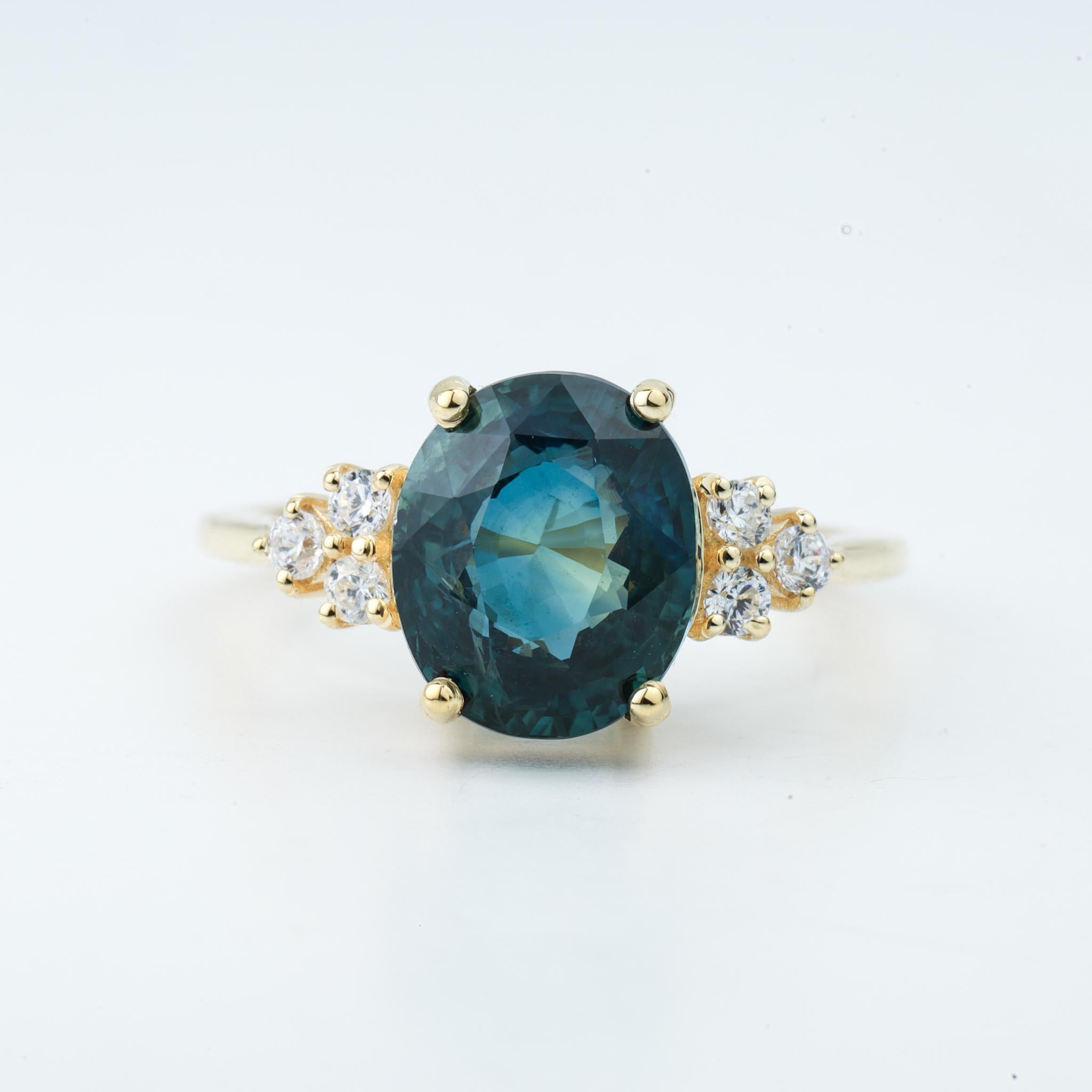 5.5 Carat Natural Teal Sapphire Oval Cocktail Engagement Ring 18k Yellow Gold

Available in 18k yellow gold.

Same design can be made also with other custom gemstones per request.

Product details:

- Solid gold

- Side diamonds - 2.2mm. E VS

-