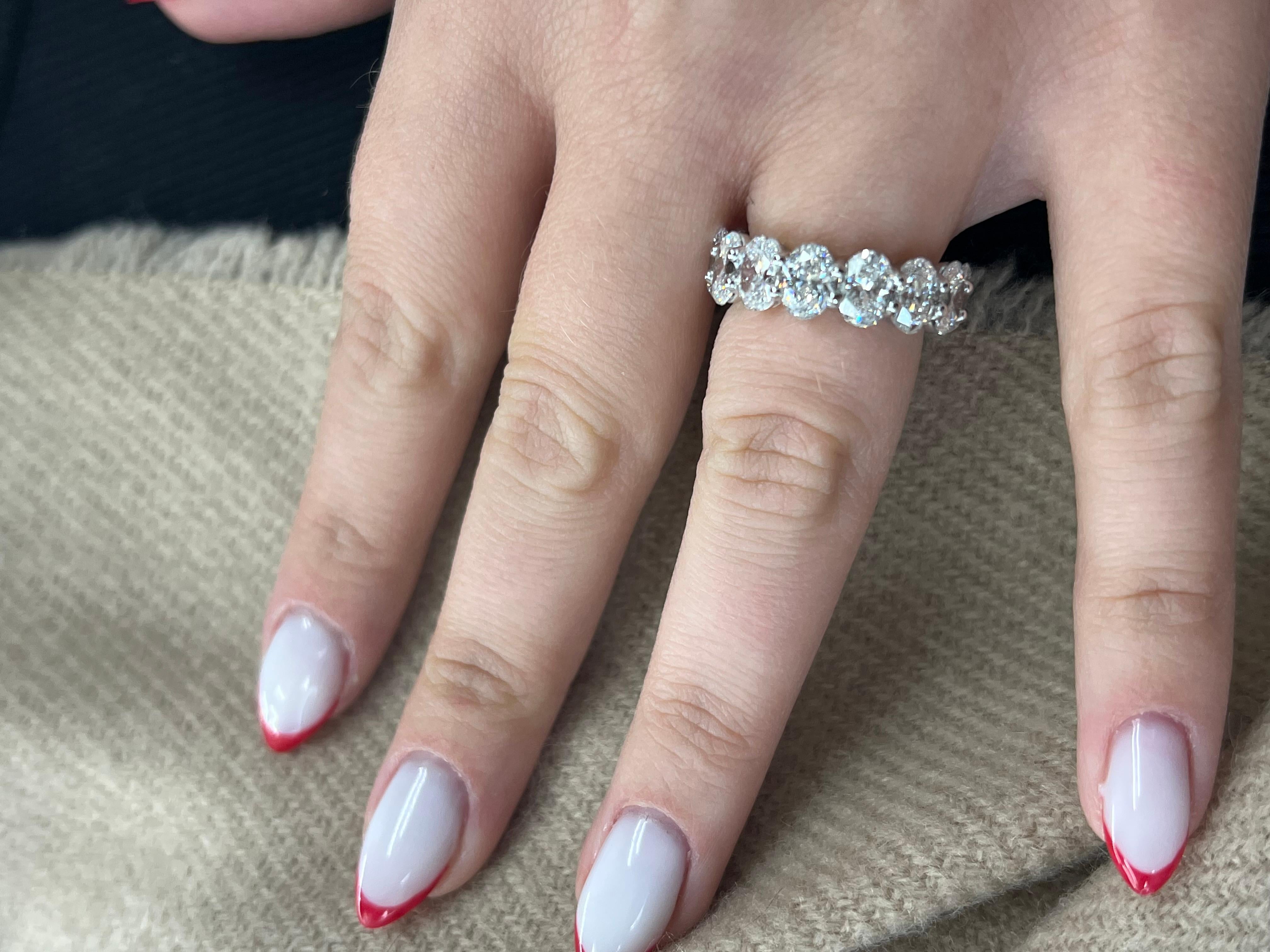 Introducing our exquisite 5.5 Carat Oval Cut Diamond Eternity Band crafted in 18K White Gold, designed to take your breath away. The 5.5 Carat Diamonds used in this eternity band are of exceptional quality and sparkle with incredible fire and