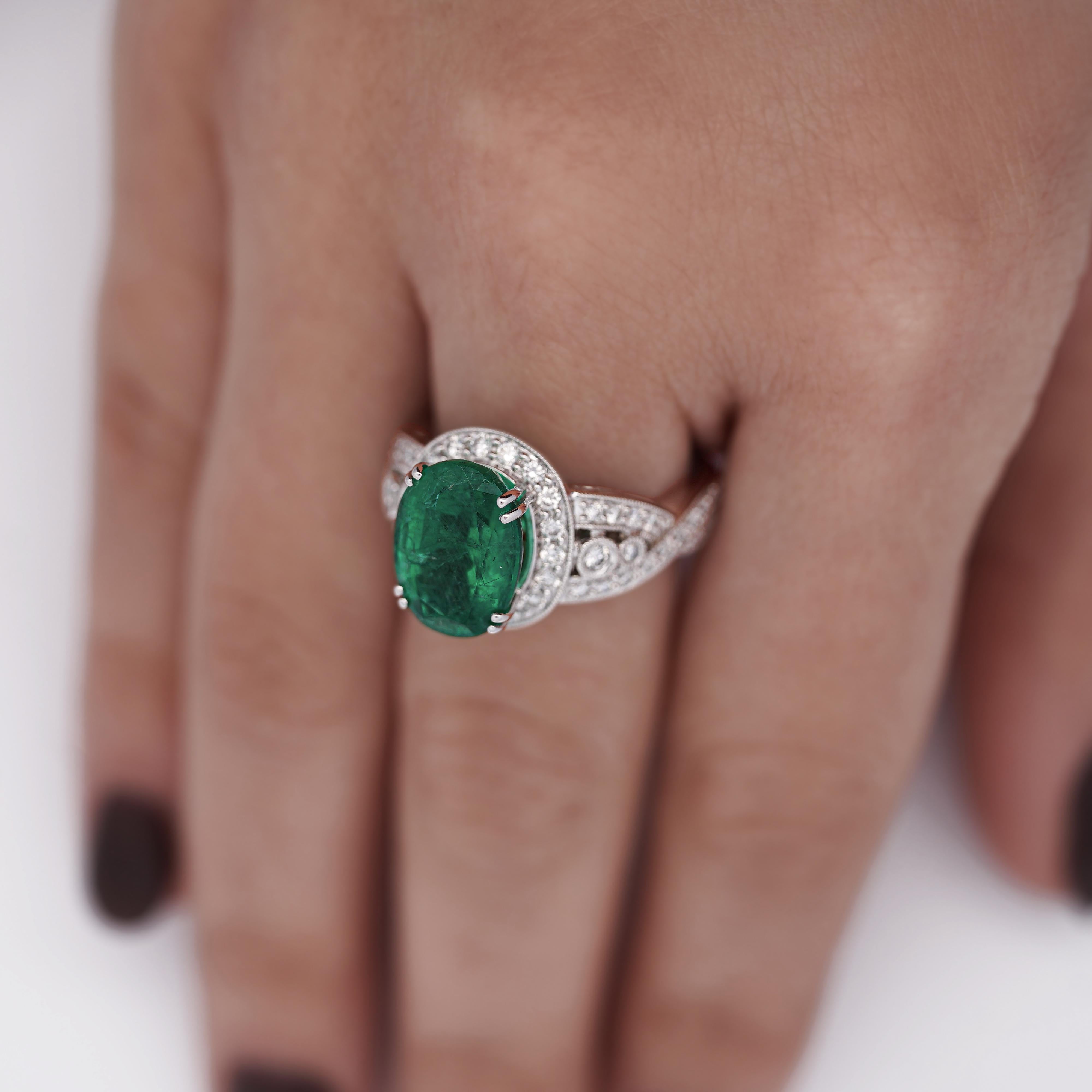 Art Nouveau 5.5 Carat Oval Cut Emerald & Diamond 18K White Gold Filigree Crossover Ring For Sale