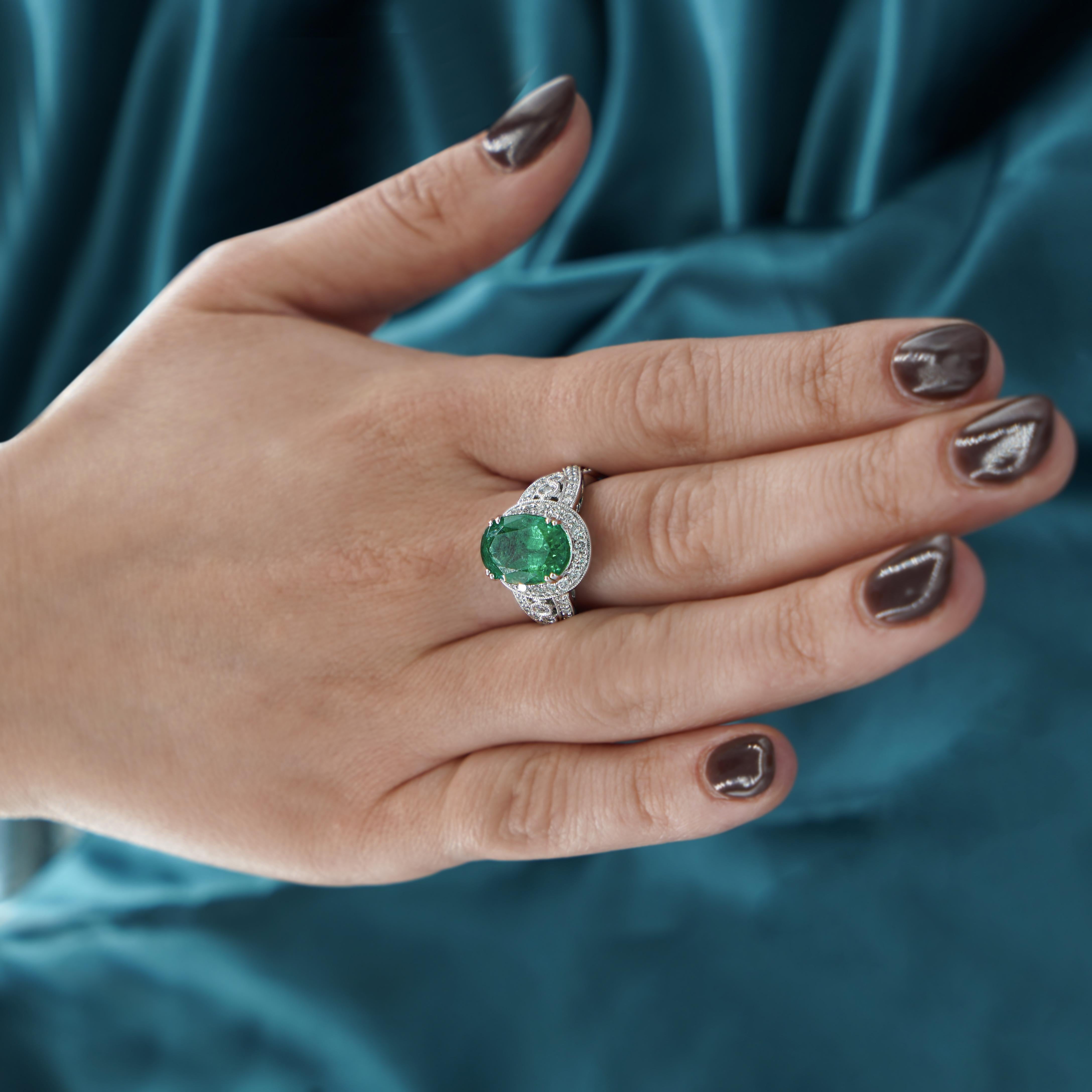 5.5 Carat Oval Cut Emerald & Diamond 18K White Gold Filigree Crossover Ring In New Condition For Sale In Miami, FL