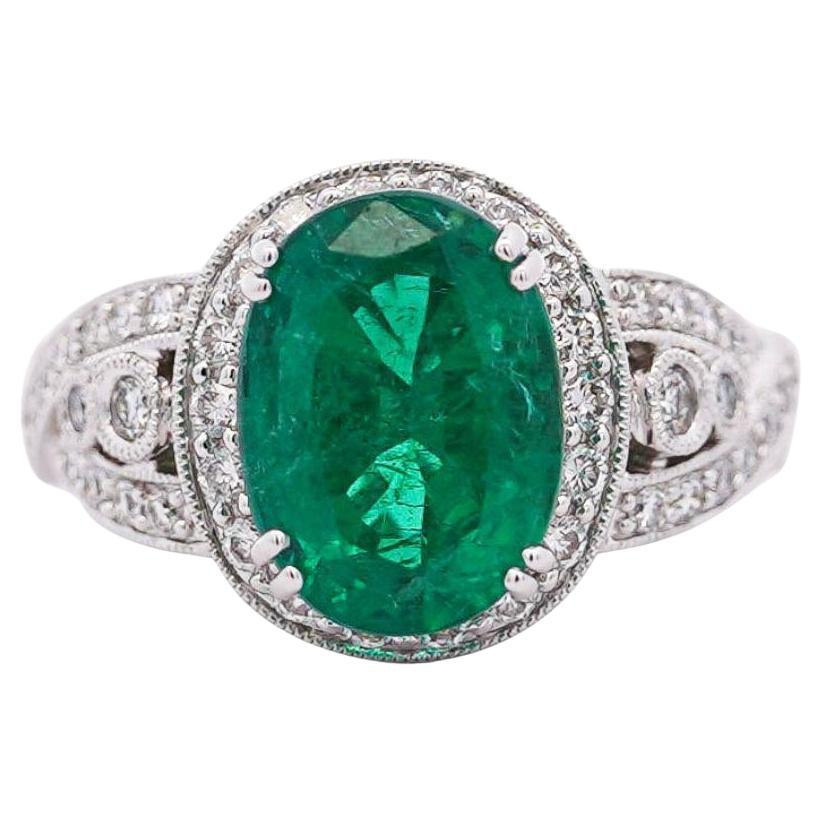 5.5 Carat Oval Cut Emerald & Diamond 18K White Gold Filigree Crossover Ring For Sale