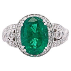 5.5 Carat Oval Cut Emerald & Diamond 18K White Gold Filigree Crossover Ring