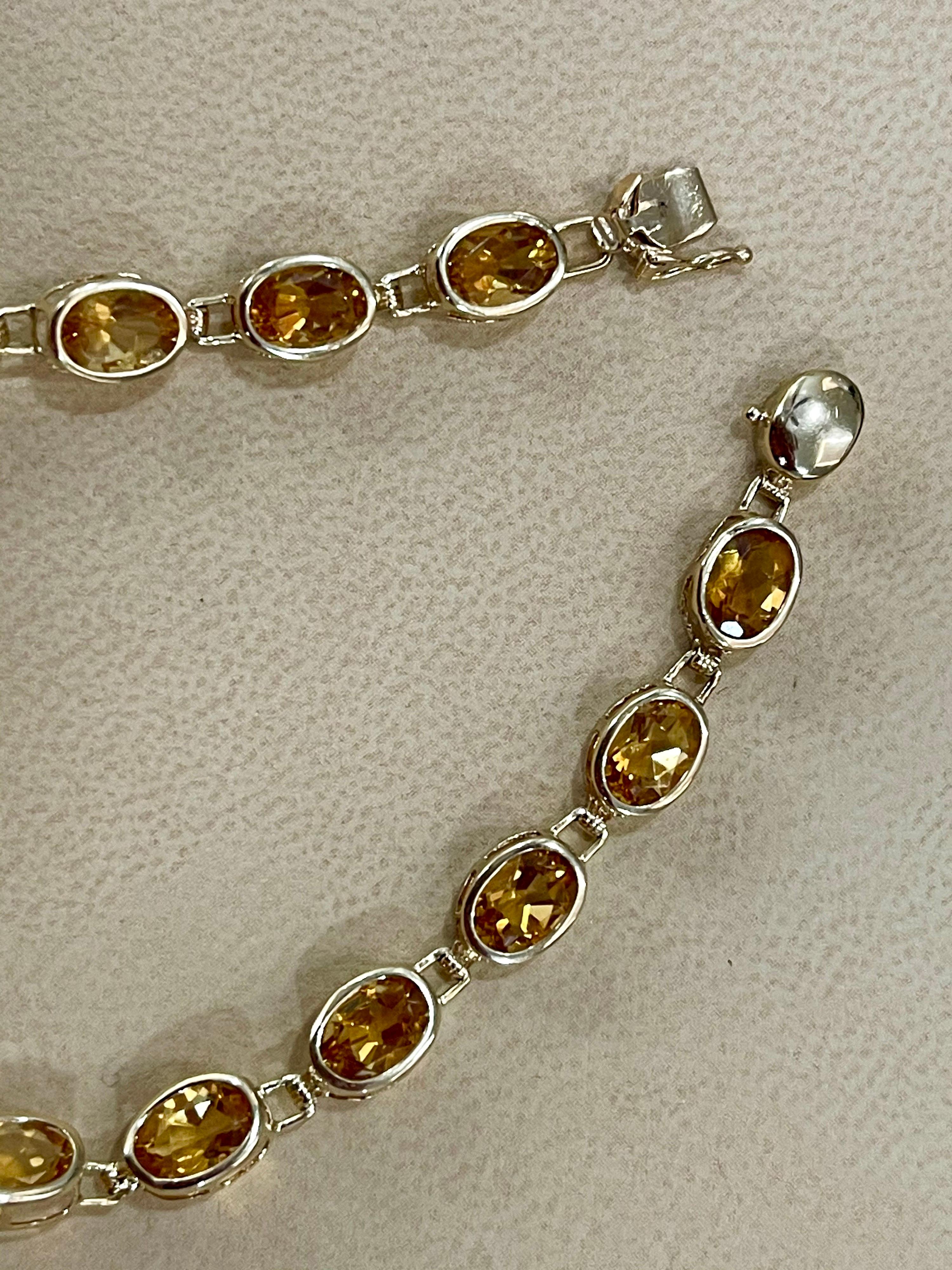  Approximately 5.5  Carat Natural Emerald Tennis Bracelet 14 Karat Yellow Gold with Diamond Accent
This exceptionally affordable Tennis  bracelet has 16 stones of oval shape natural Citrine
No prongs . its bezel set stones
This is a clearance item