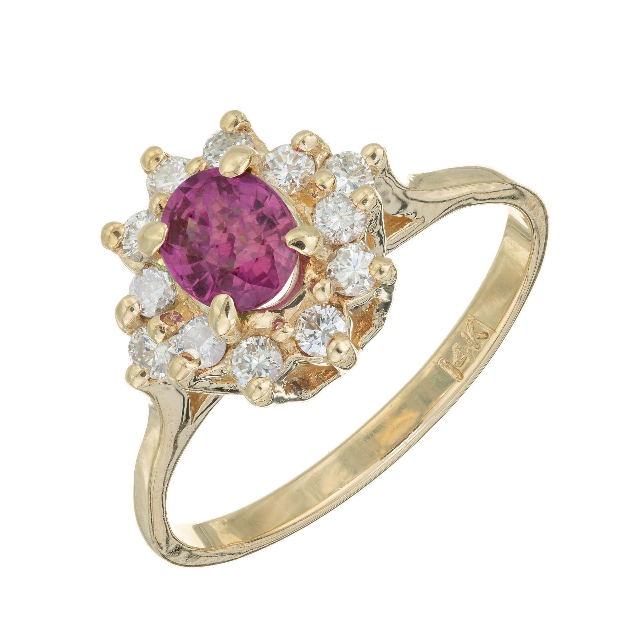 Beautiful pink Sapphire and diamond engagement ring. .55cts oval center pink sapphire with a halo of 12 round diamonds in a 14k yellow gold setting. 

1 genuine pink sapphire approx. total weight .55cts
12 round diamonds approx. total weight .30cts,