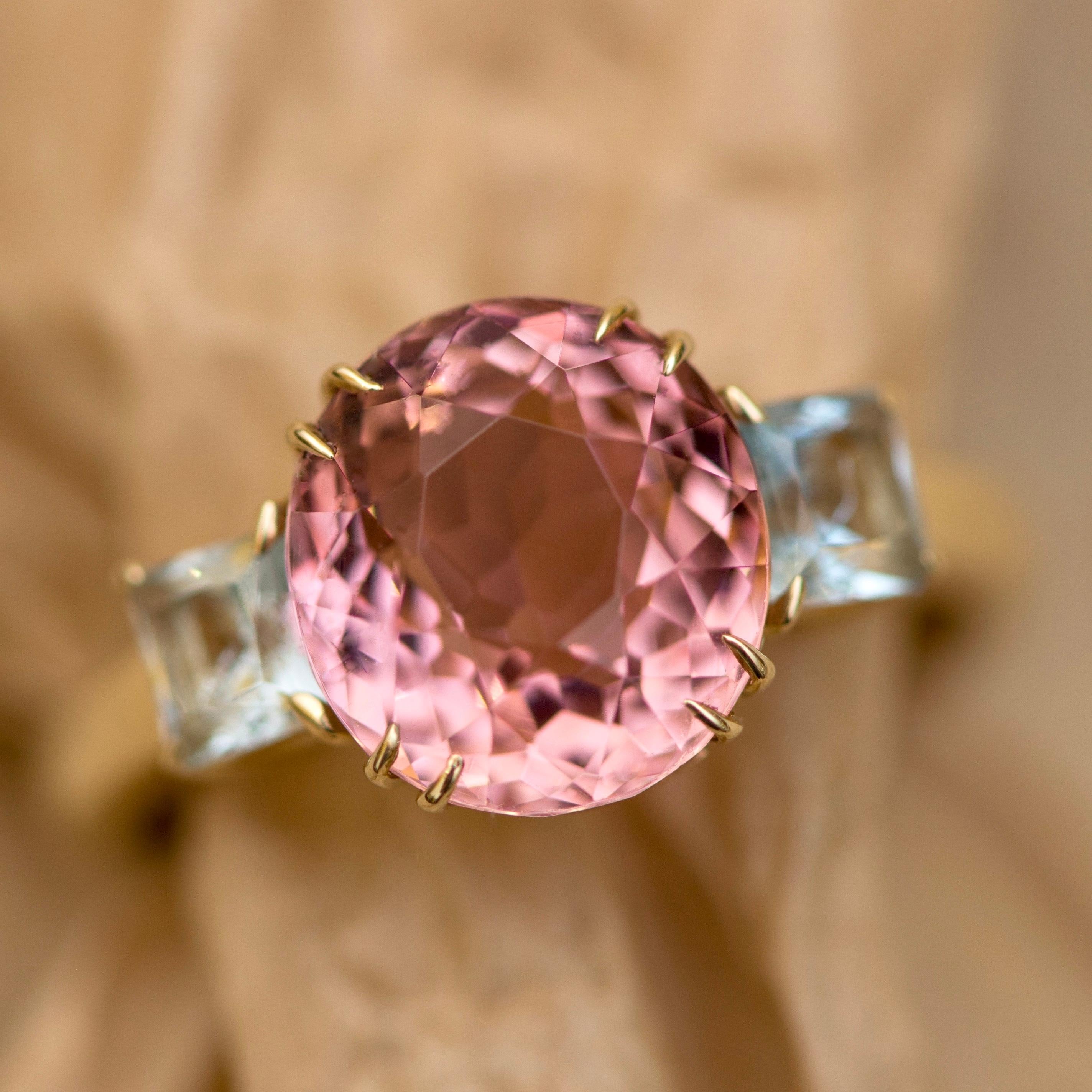 It is believed that pink tourmaline is a symbol of love and tenderness.
This tourmaline have very interesting pink hue - you could see delicate pink, dark pink, peach, little bit burgundy when you just move it.
It is very common thing for